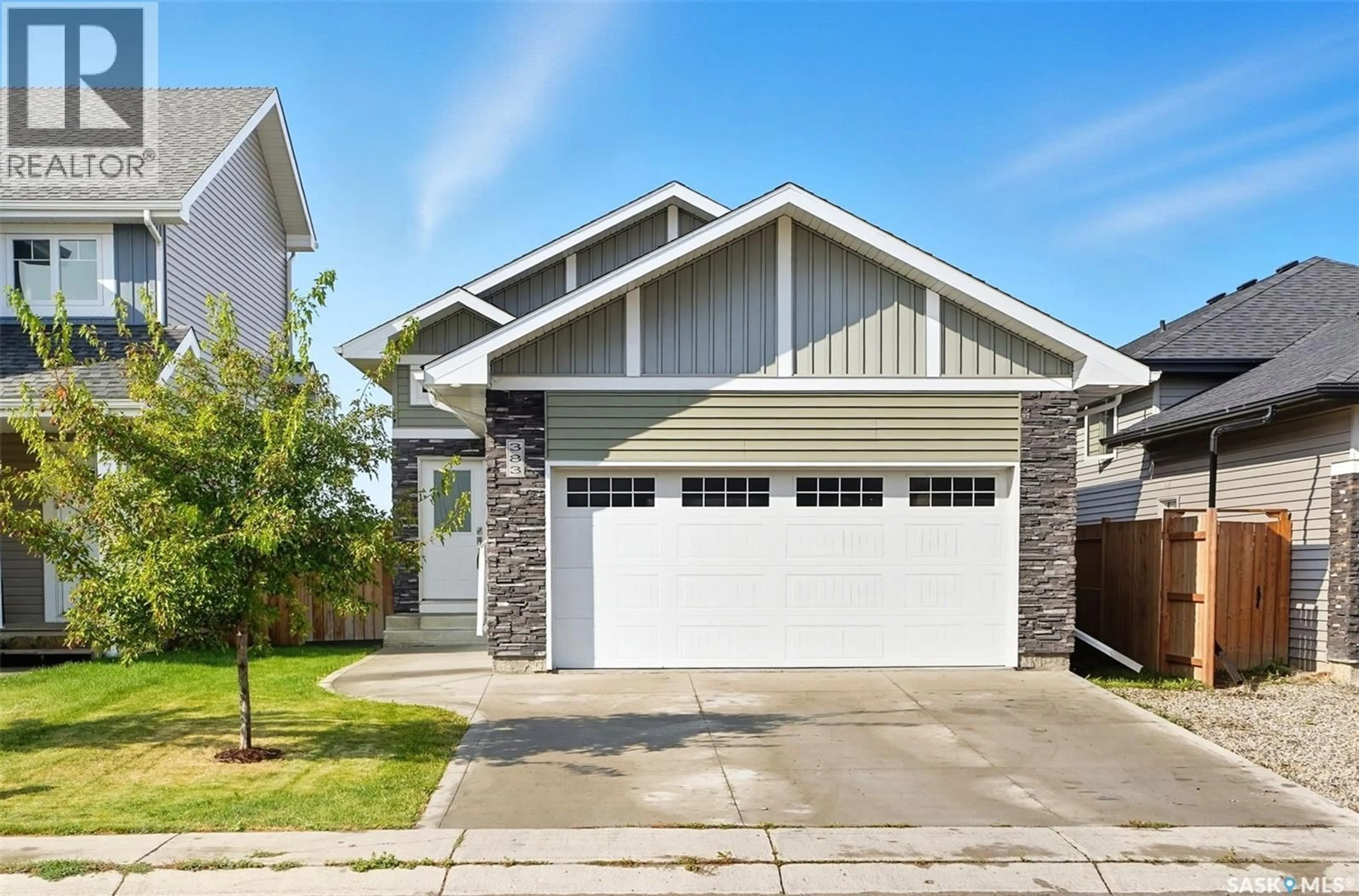 Home with vinyl exterior material, street for 383 HASSARD CLOSE, Saskatoon Saskatchewan S7L4Z7