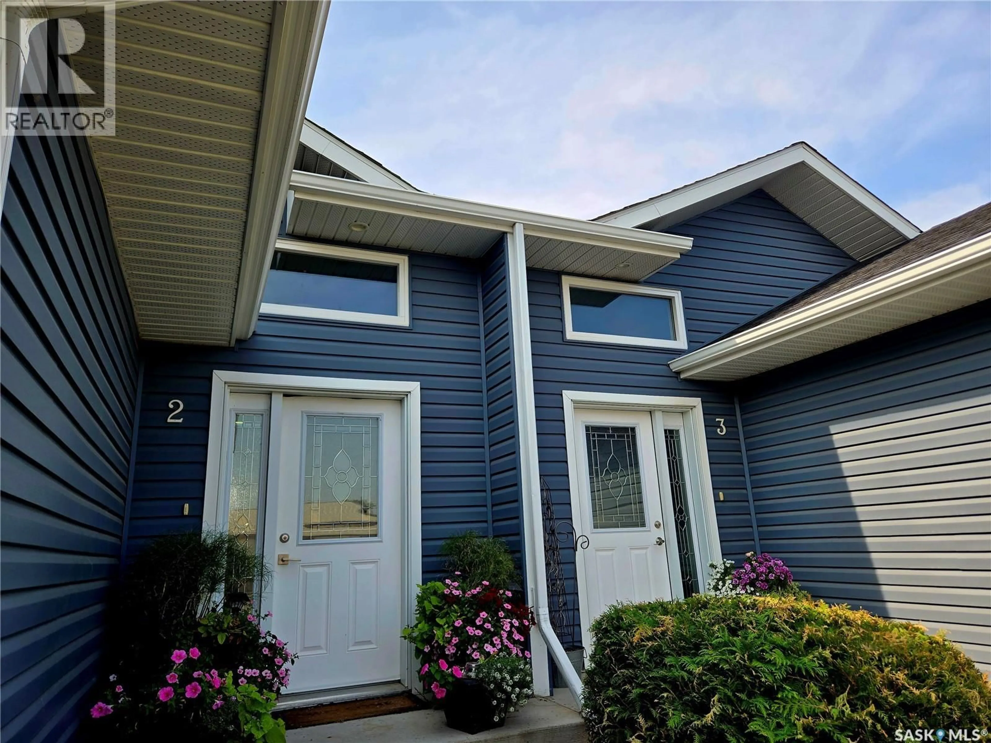Home with vinyl exterior material, street for 1-4 316 3RD STREET, Delisle Saskatchewan S0L0P0