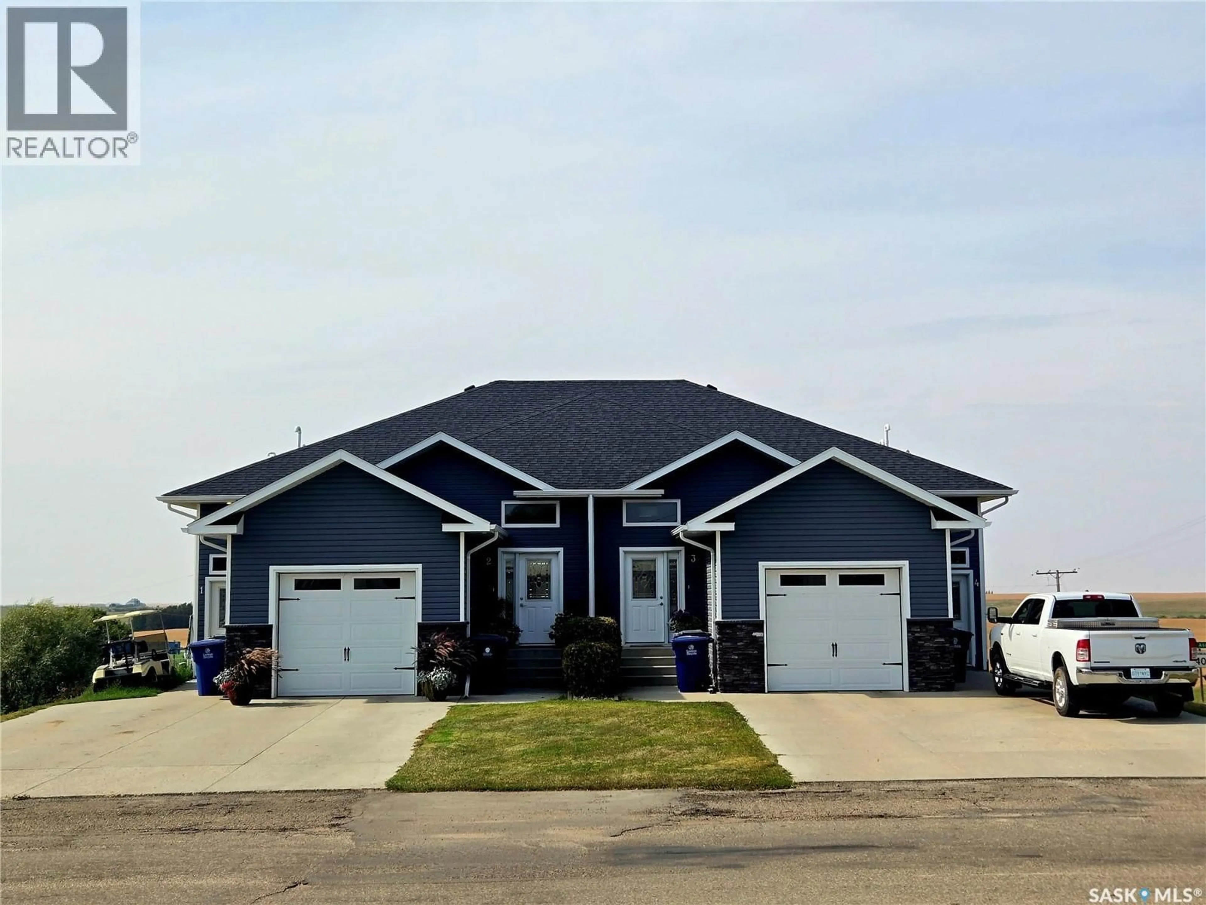 Home with vinyl exterior material, street for 1-4 316 3RD STREET, Delisle Saskatchewan S0L0P0