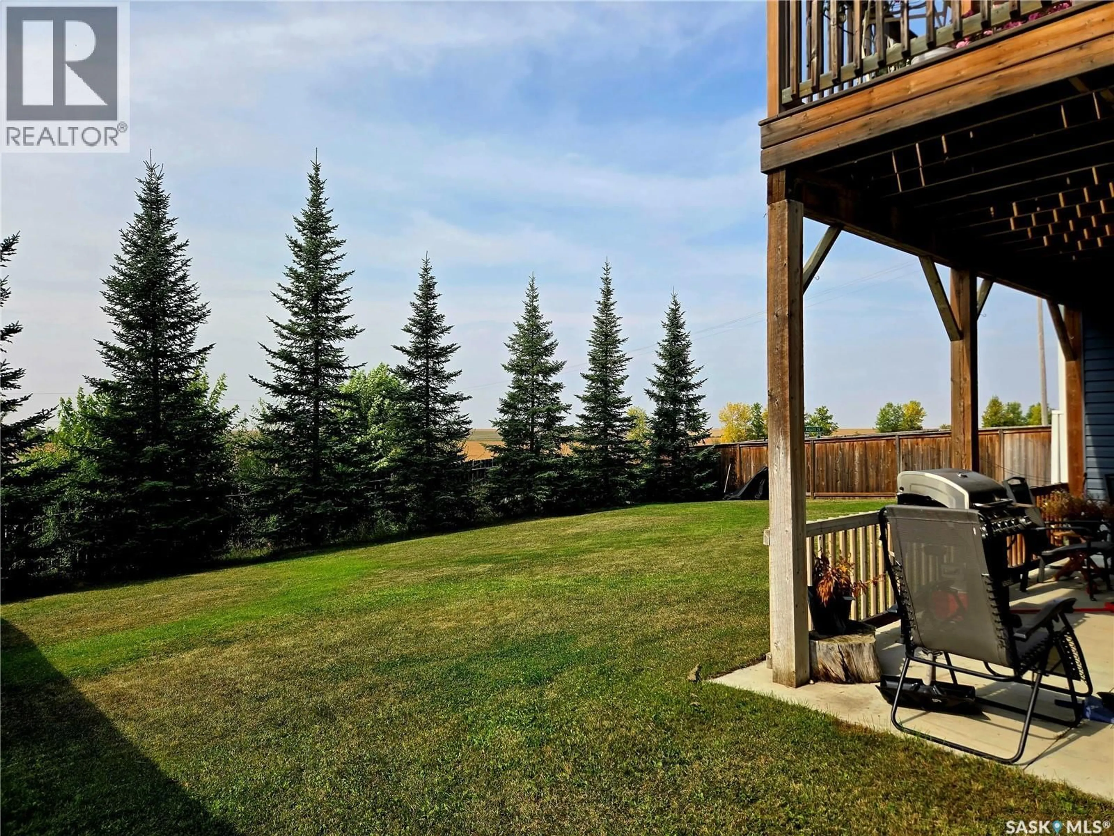Patio, forest/trees view for 1-4 316 3RD STREET, Delisle Saskatchewan S0L0P0