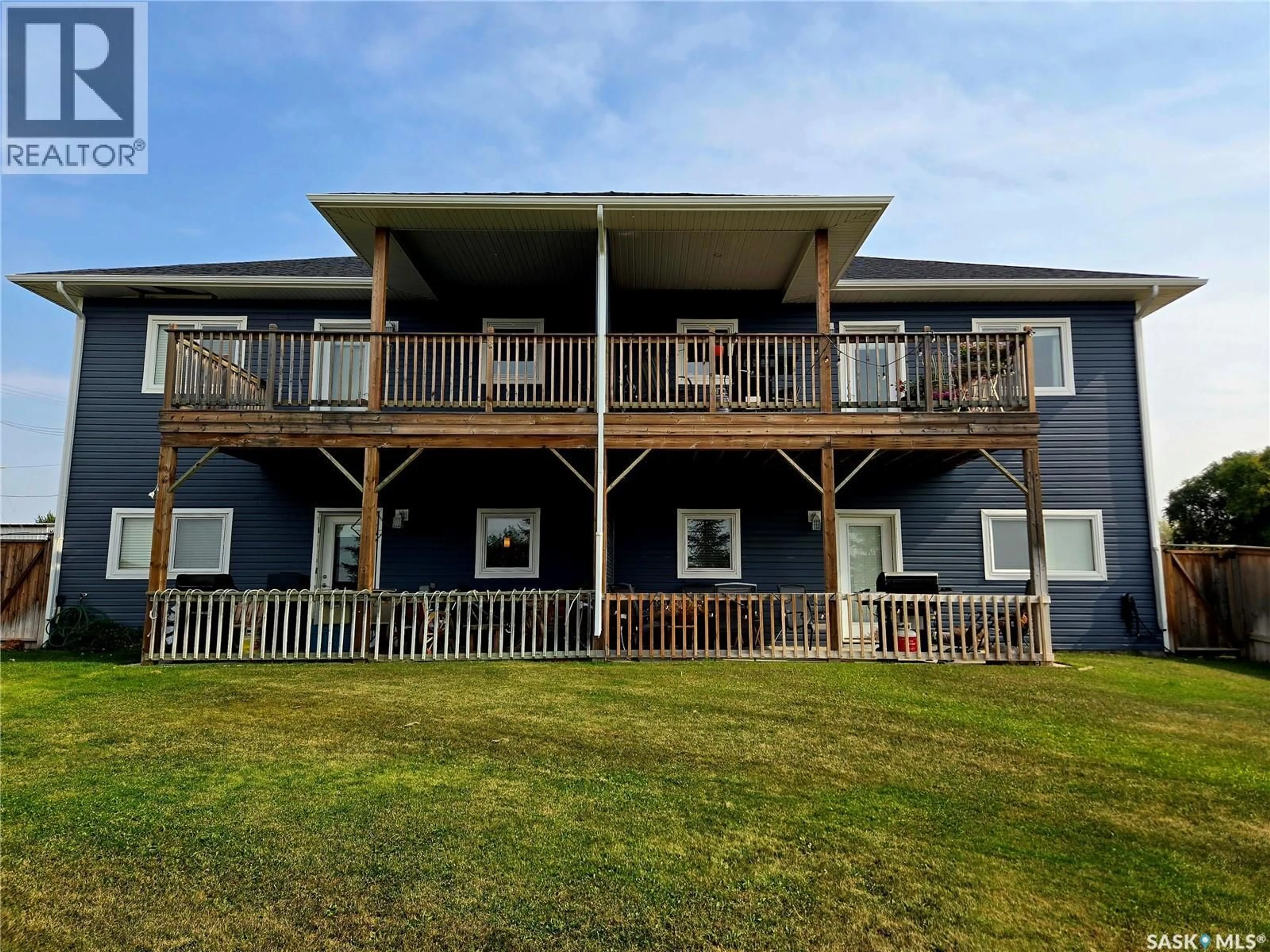 A pic from outside/outdoor area/front of a property/back of a property/a pic from drone, unknown for 1-4 316 3RD STREET, Delisle Saskatchewan S0L0P0