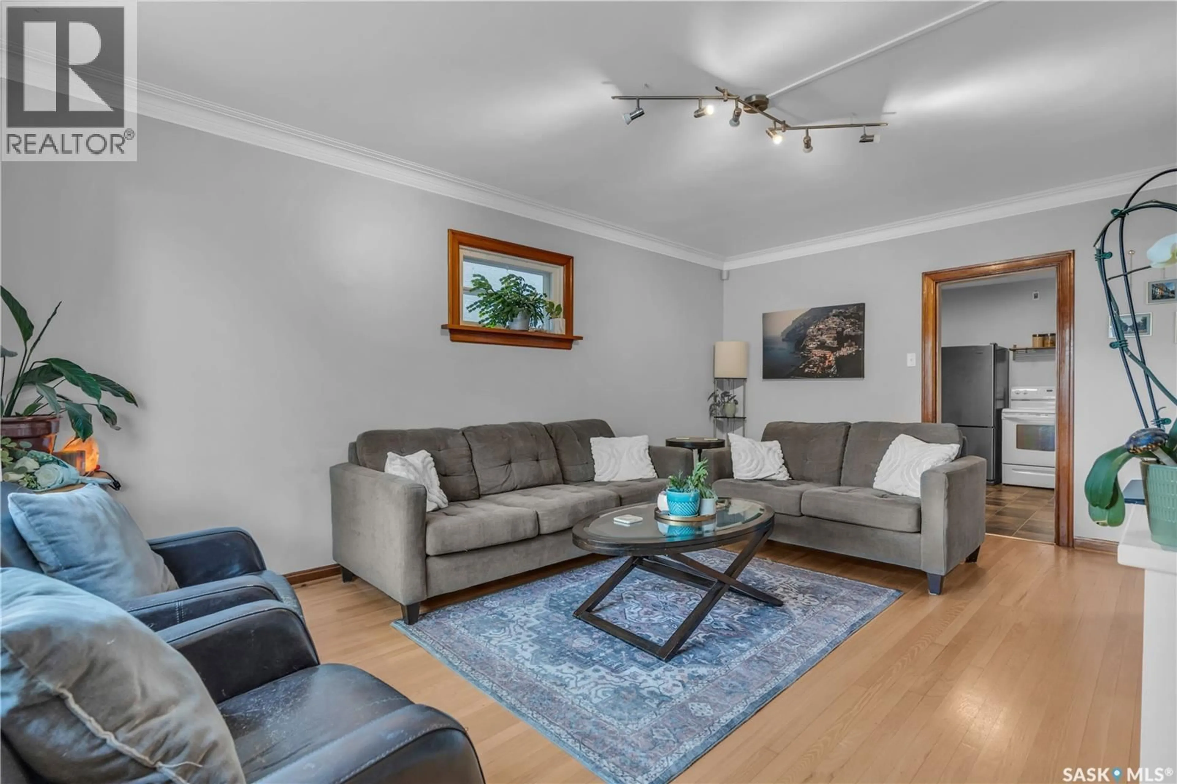Living room with furniture, wood/laminate floor for 2532 REYNOLDS STREET, Regina Saskatchewan S4N3N9