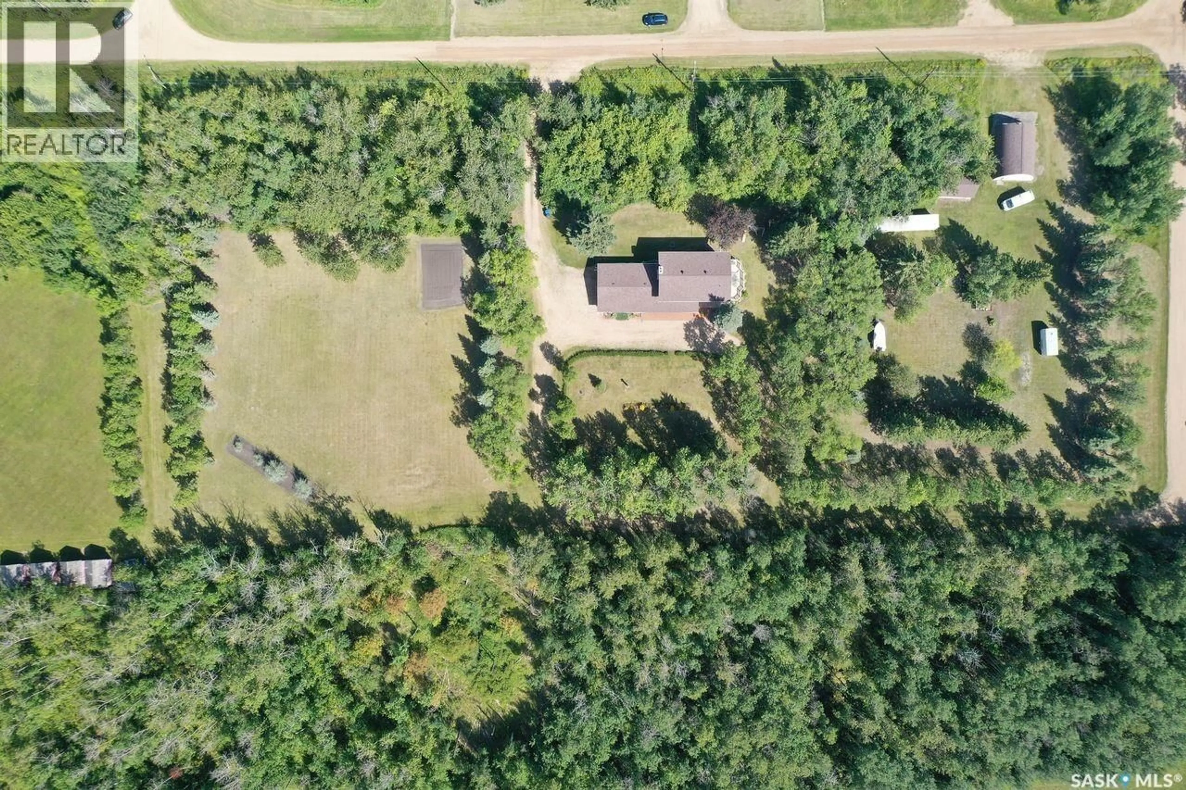 A pic from outside/outdoor area/front of a property/back of a property/a pic from drone, forest/trees view for 324 KALMAKOFF AVENUE, Canora Saskatchewan S0A0L0