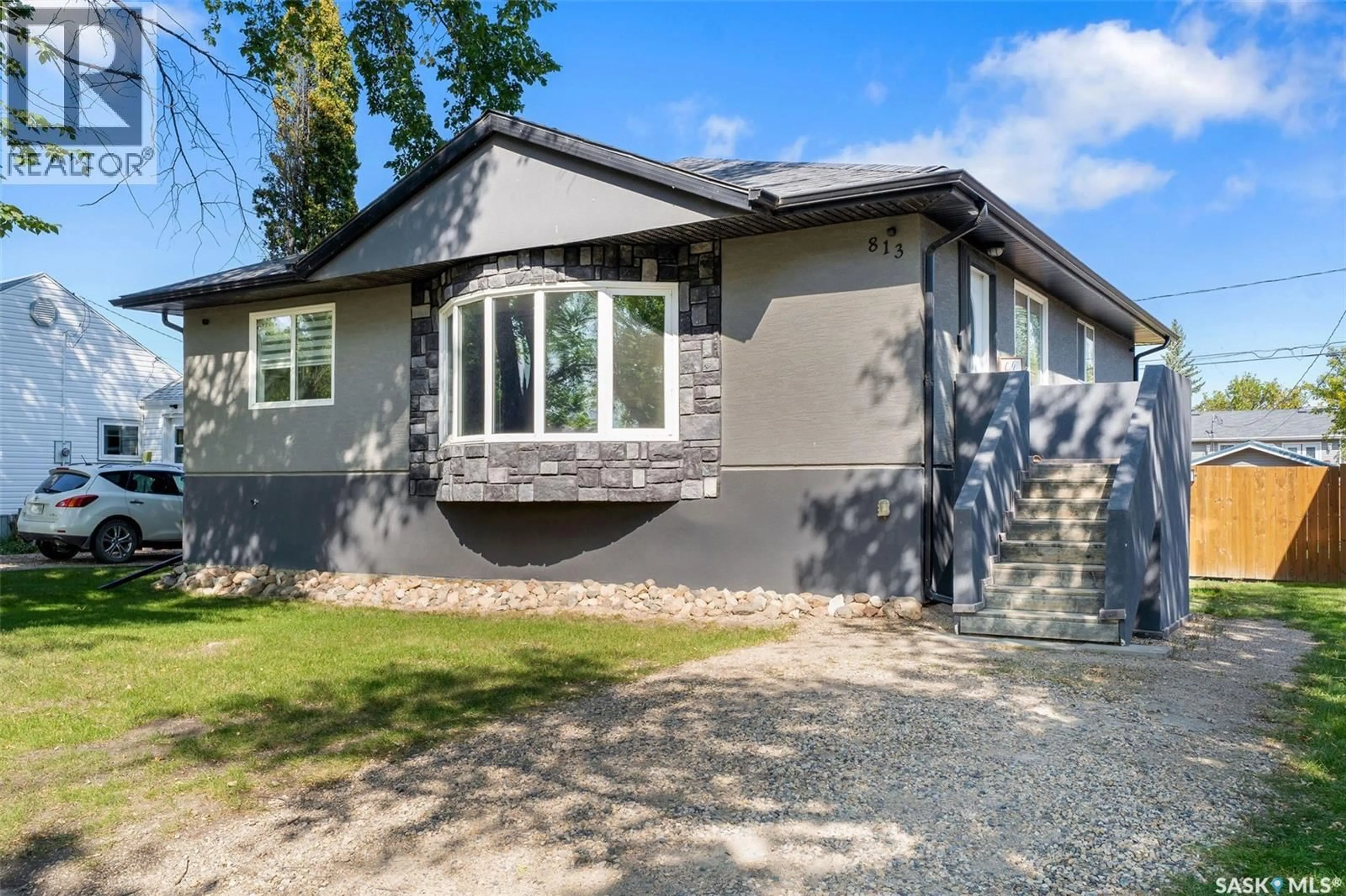Home with vinyl exterior material, street for 813 98TH AVENUE, Tisdale Saskatchewan S0E1T0