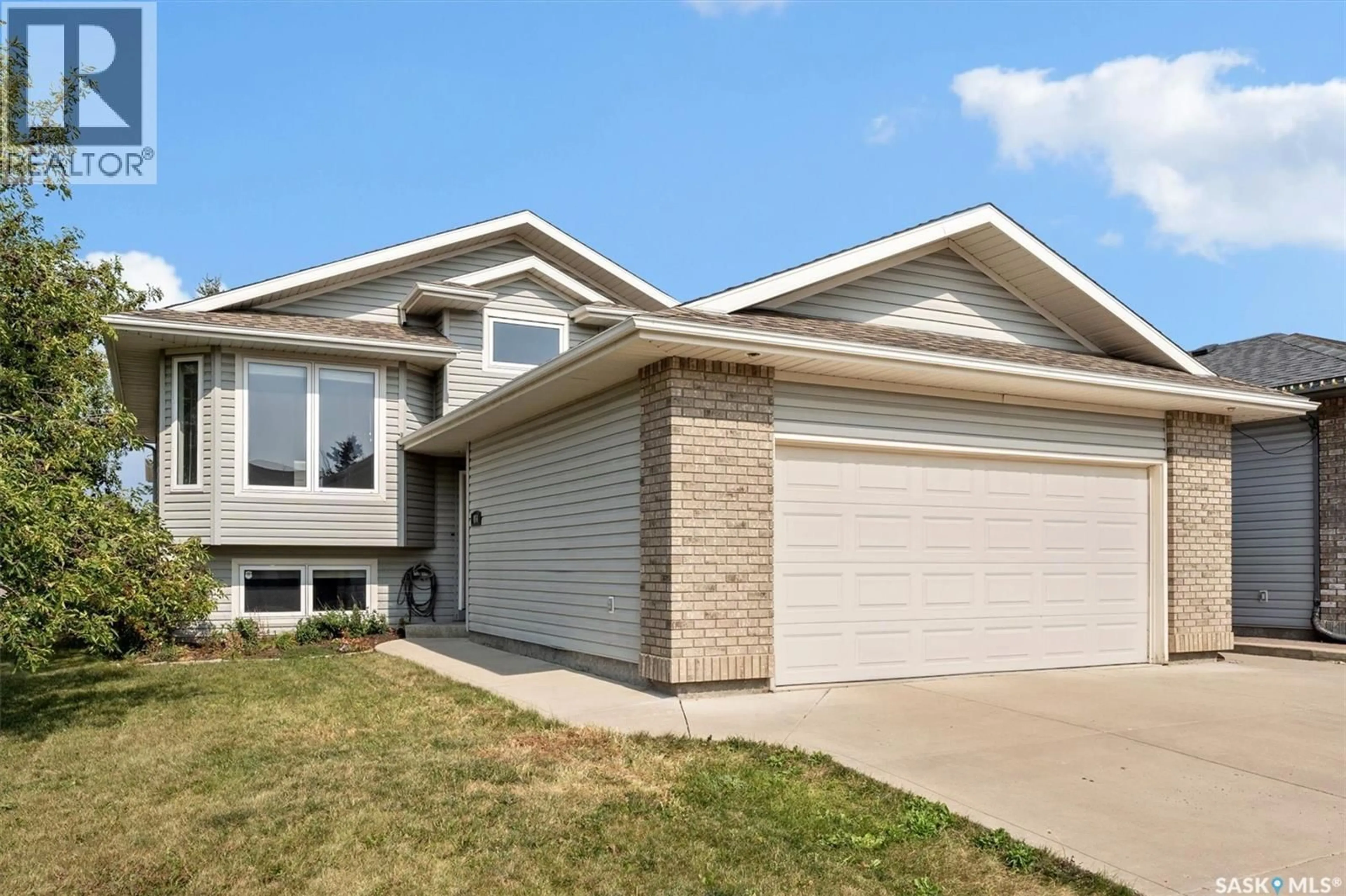 Home with vinyl exterior material, street for 454 BUCKWOLD COVE, Saskatoon Saskatchewan S7N4W1