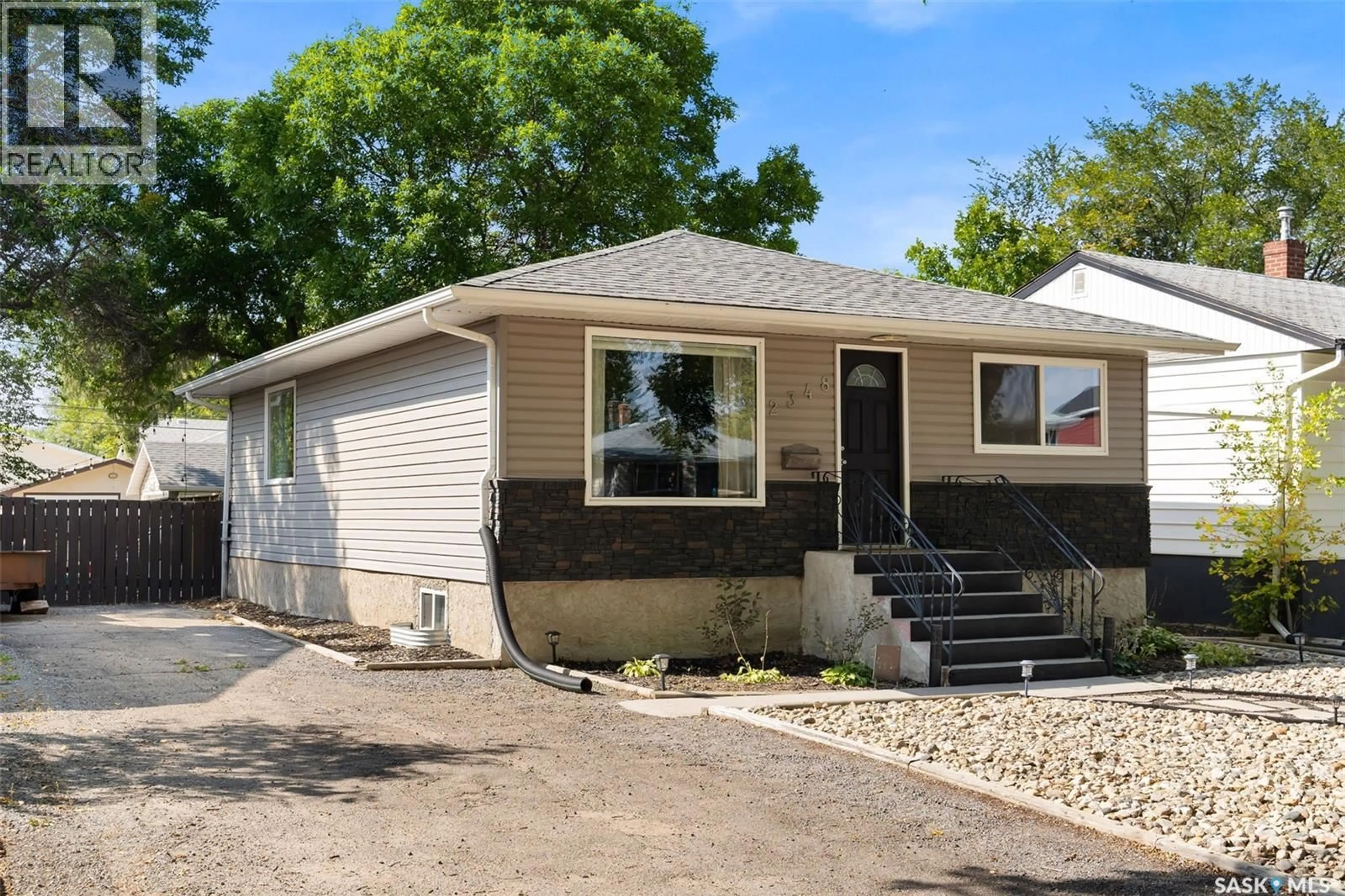 Home with vinyl exterior material, street for 2348 FRANCIS STREET, Regina Saskatchewan S4N2P7