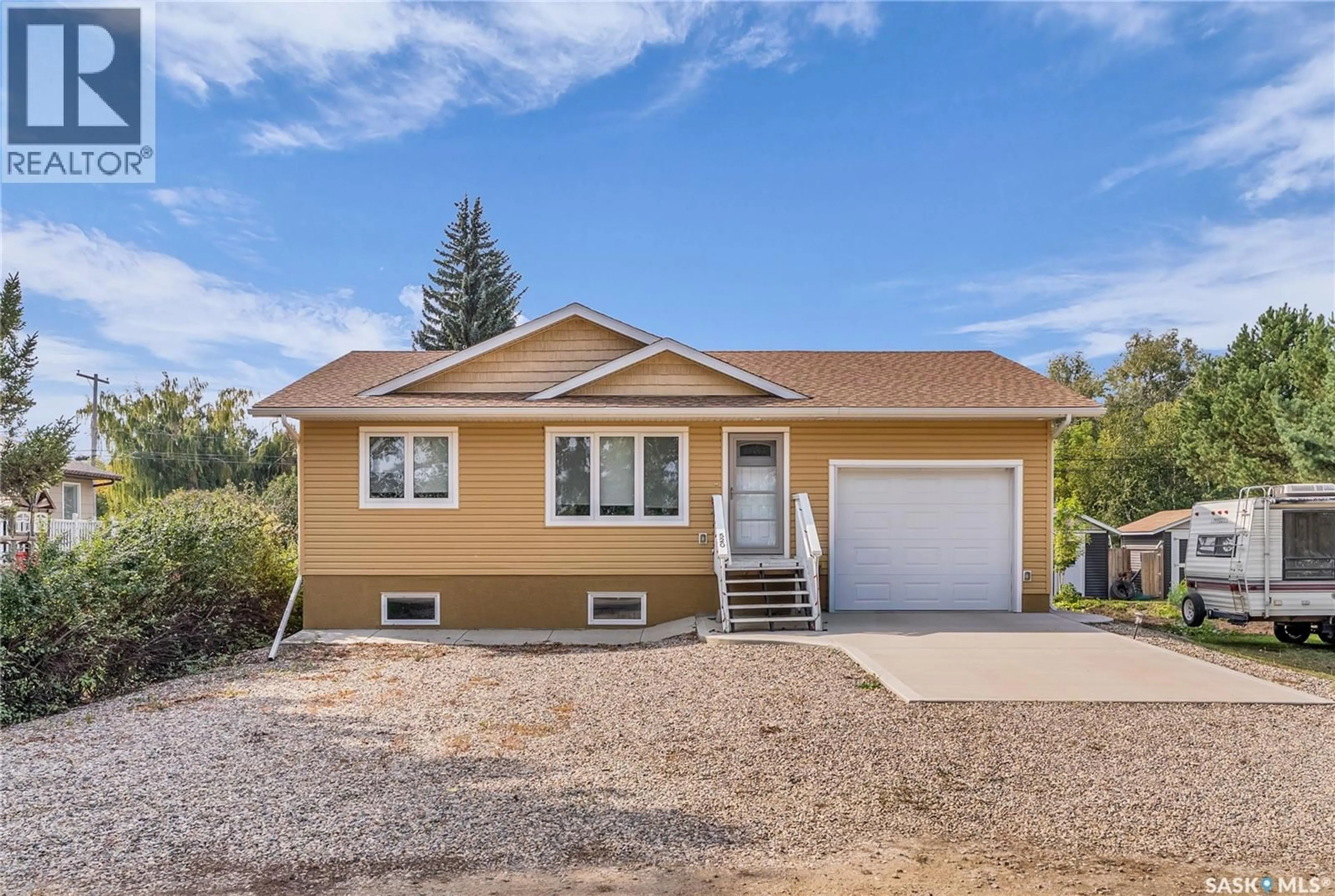 Home with vinyl exterior material, street for 520 LUNN STREET, Asquith Saskatchewan S0K0J0