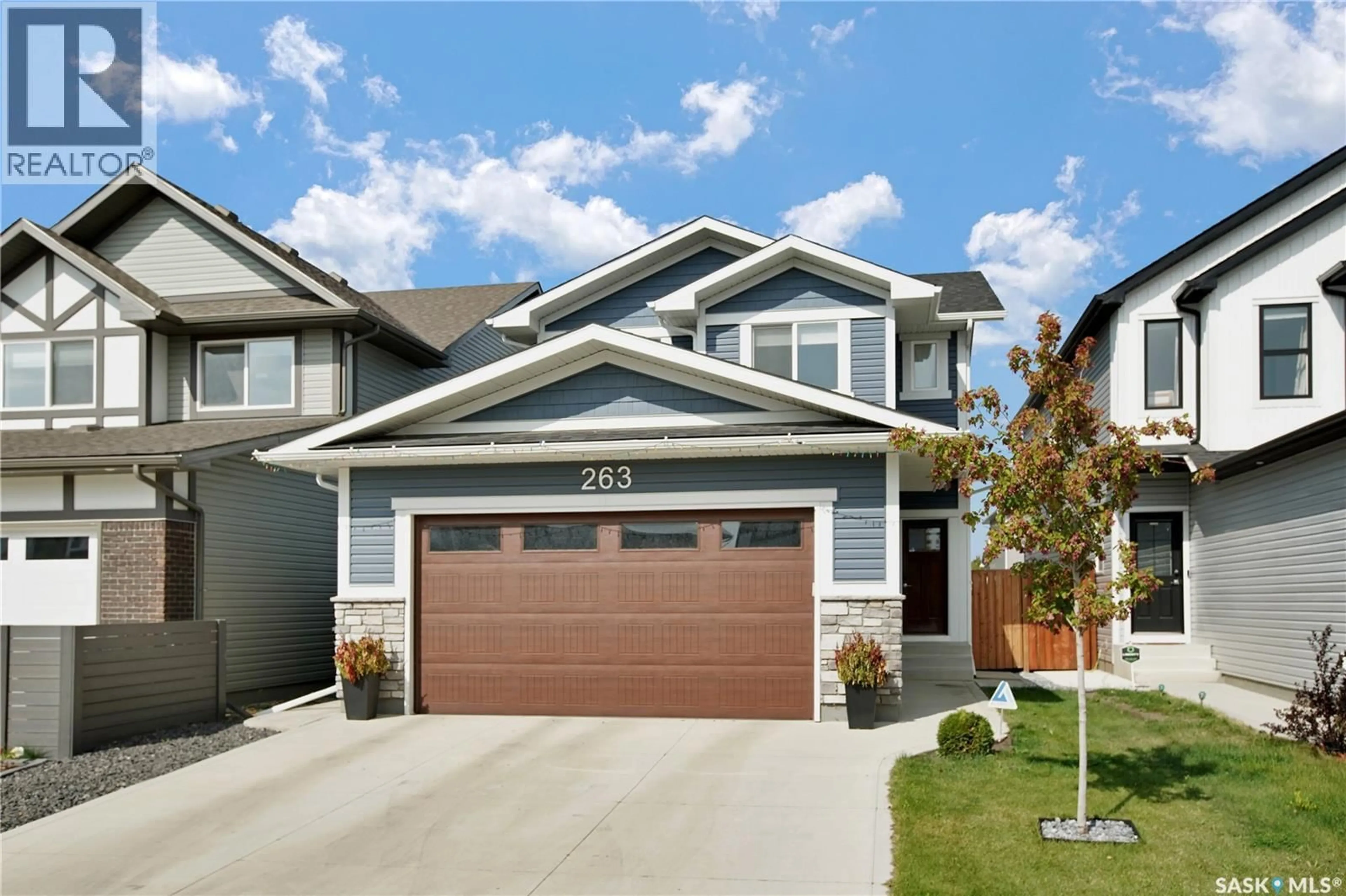 Home with vinyl exterior material, street for 263 SKOPIK CRESCENT, Saskatoon Saskatchewan S7V0V6