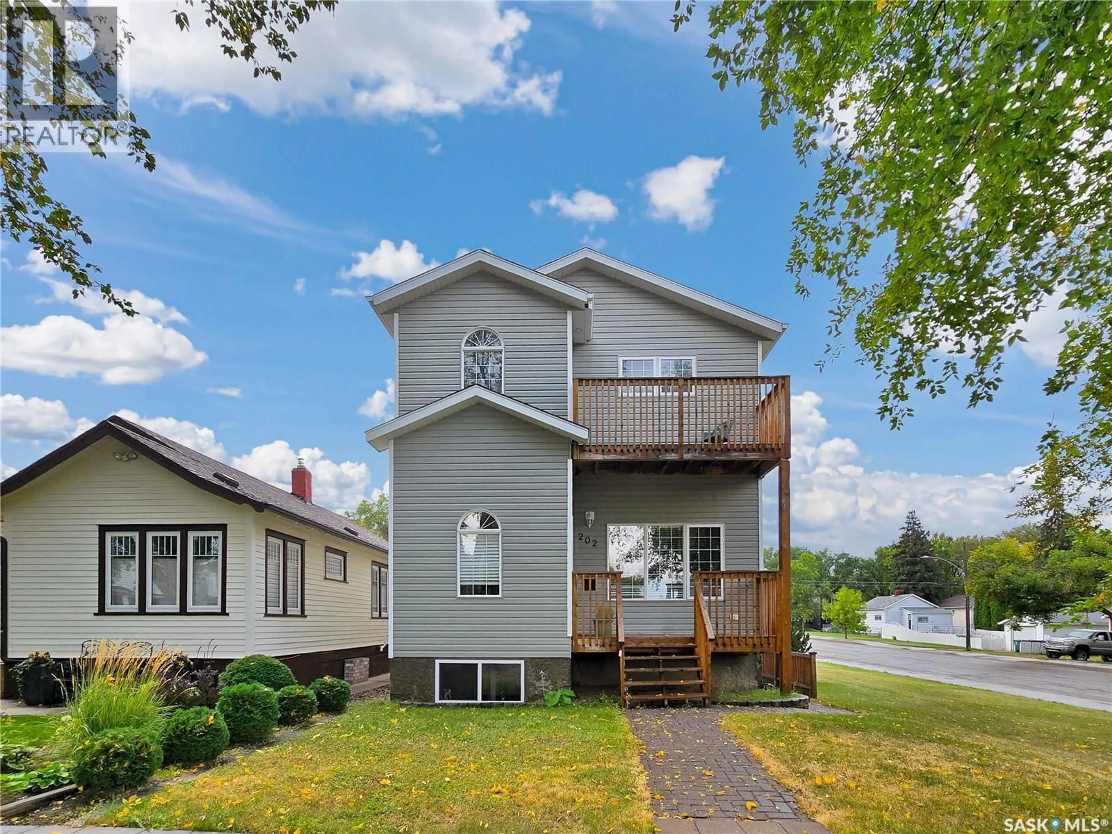 Home with vinyl exterior material, street for 202 2ND STREET, Saskatoon Saskatchewan S7H1N6