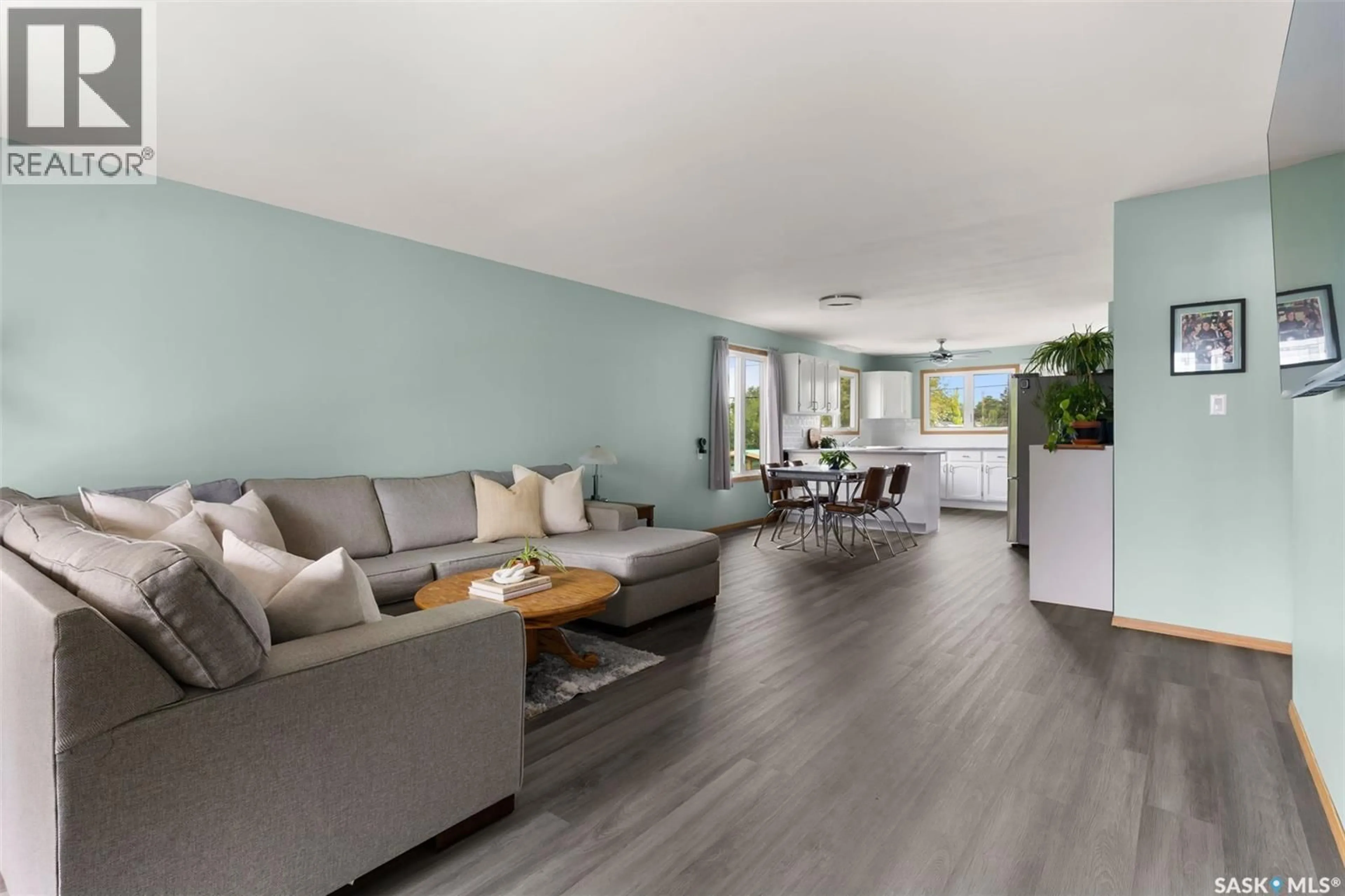 Living room with furniture, wood/laminate floor for 265 BROWNING STREET, Southey Saskatchewan S0G4P0