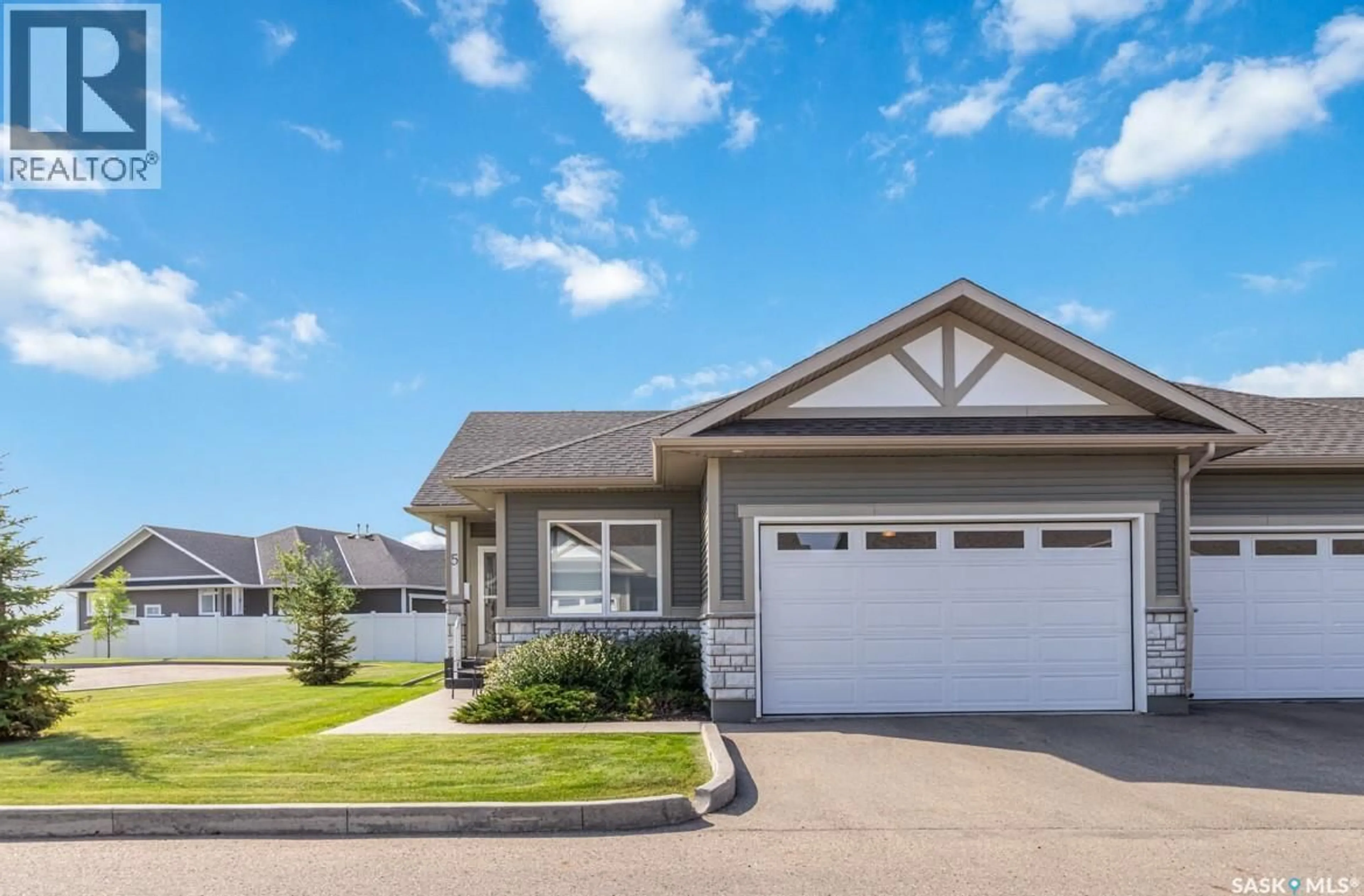 Home with vinyl exterior material, street for 5 PALMER CRESCENT, Warman Saskatchewan S0K4S1