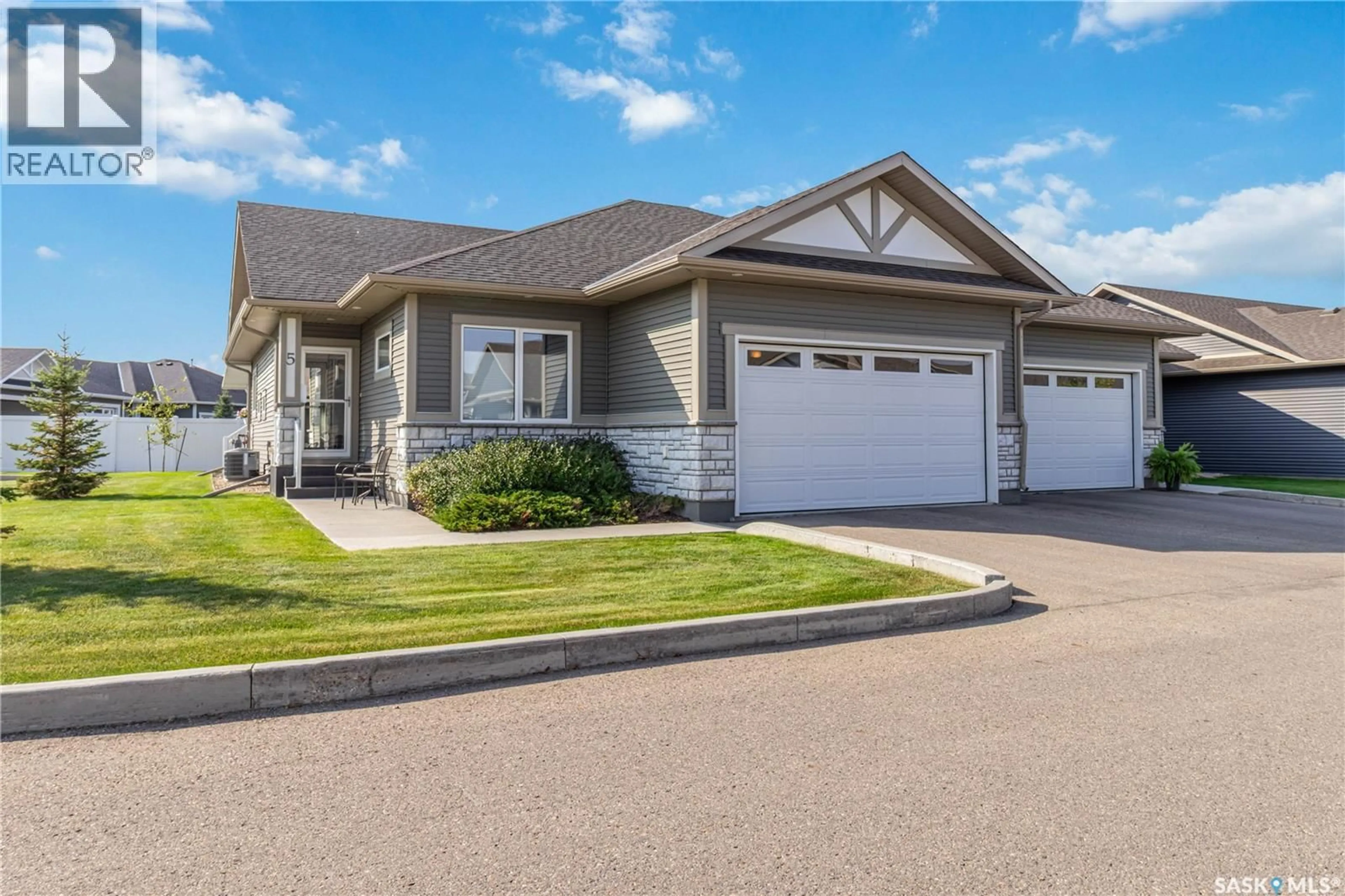 Home with vinyl exterior material, street for 5 PALMER CRESCENT, Warman Saskatchewan S0K4S1