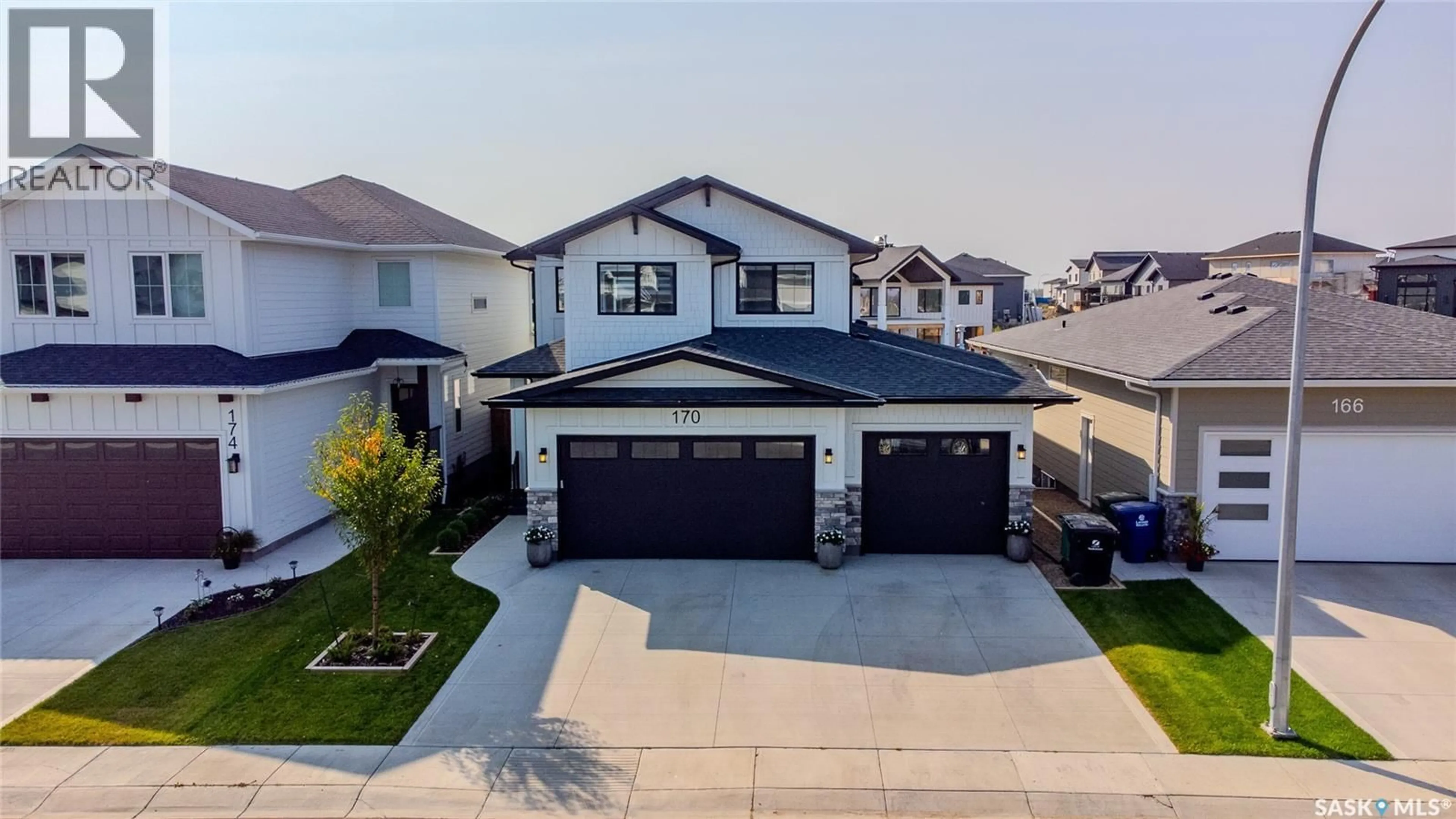 A pic from outside/outdoor area/front of a property/back of a property/a pic from drone, street for 170 KEITH WAY, Saskatoon Saskatchewan S7V0X9