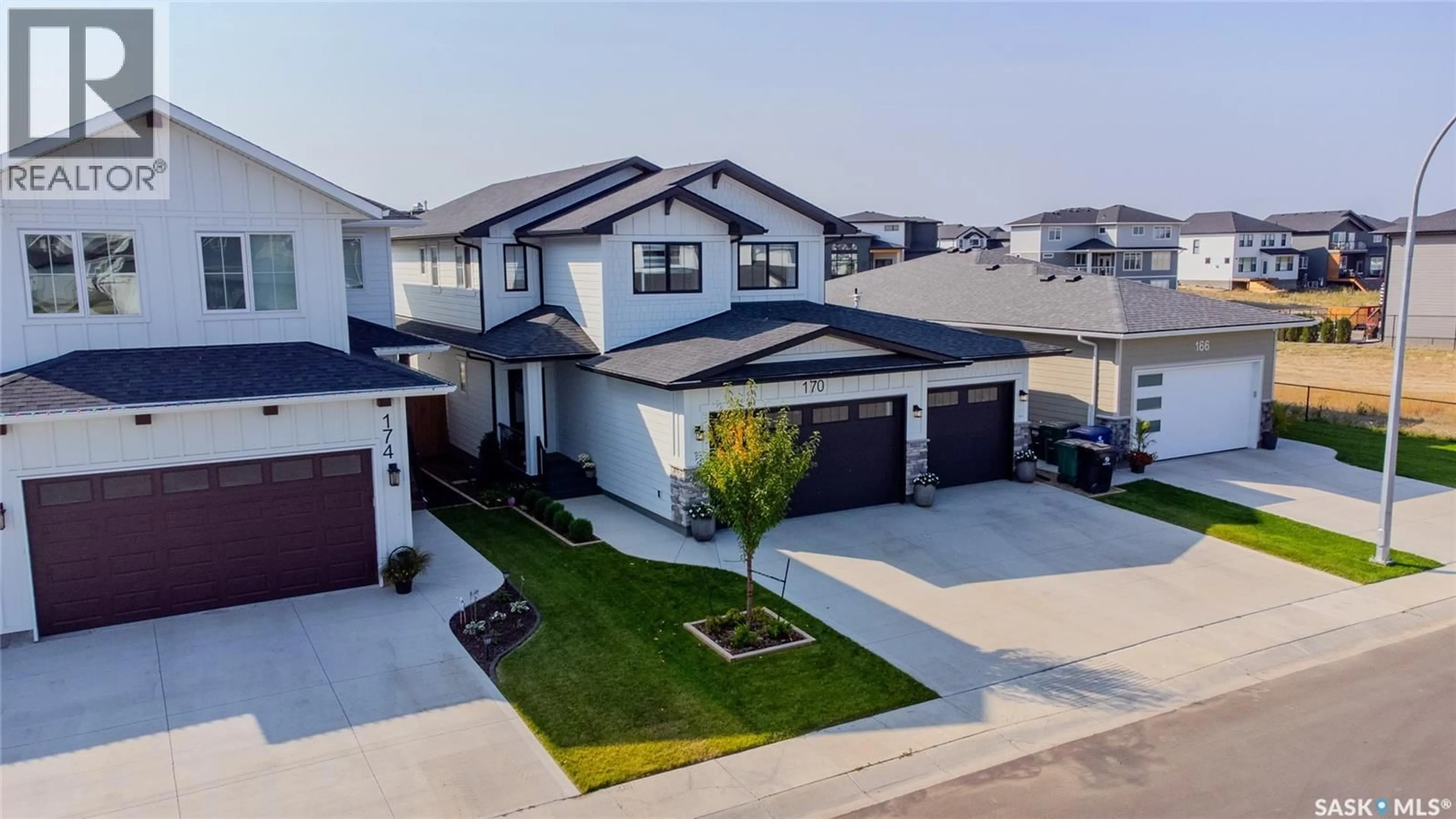A pic from outside/outdoor area/front of a property/back of a property/a pic from drone, street for 170 KEITH WAY, Saskatoon Saskatchewan S7V0X9