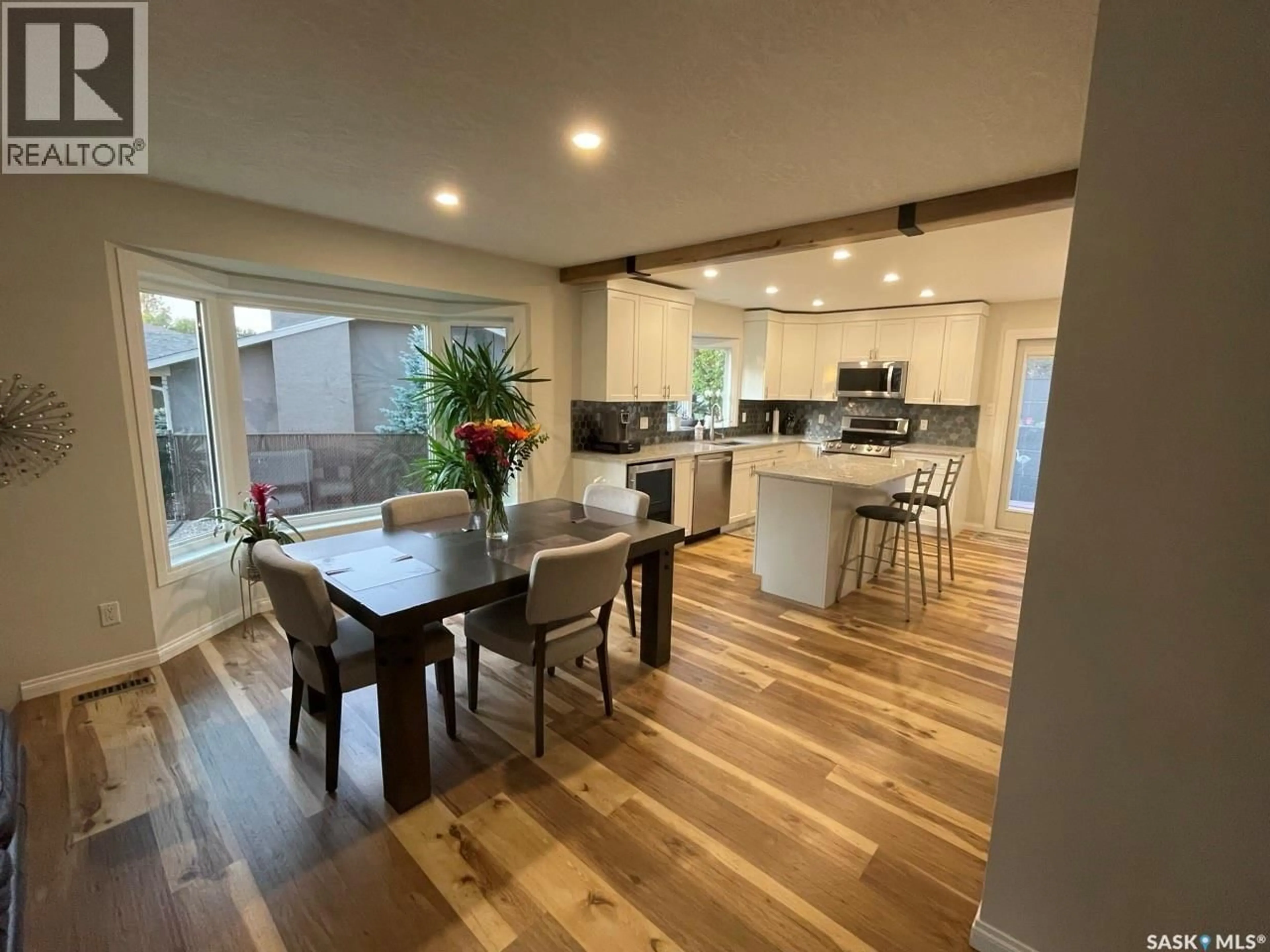 Open concept kitchen, wood/laminate floor for 1435 RADWAY STREET, Regina Saskatchewan S4X4A8