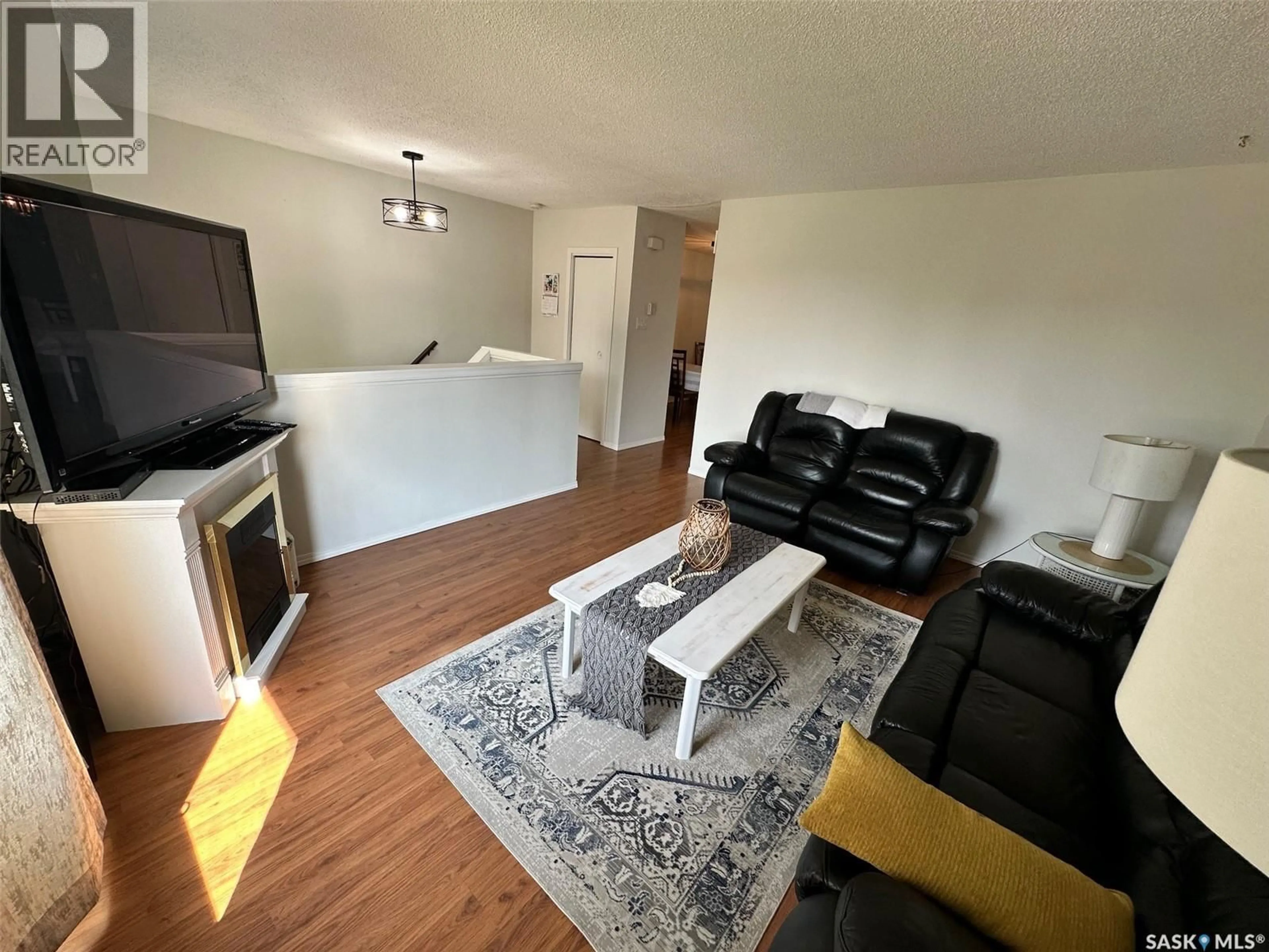 Living room with furniture, wood/laminate floor for 534 MAIN STREET, Hudson Bay Saskatchewan S0E0Y0