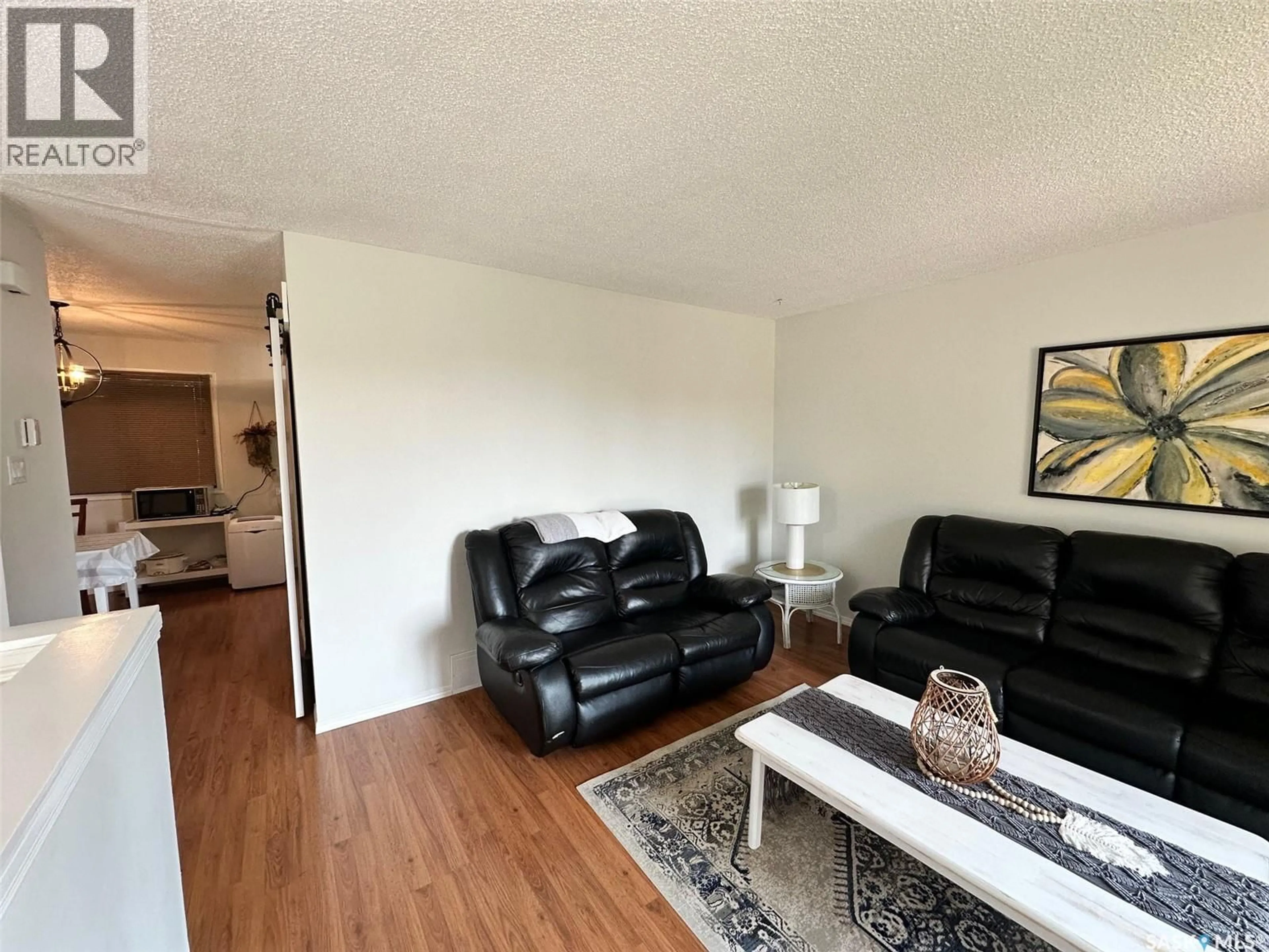 Living room with furniture, wood/laminate floor for 534 MAIN STREET, Hudson Bay Saskatchewan S0E0Y0