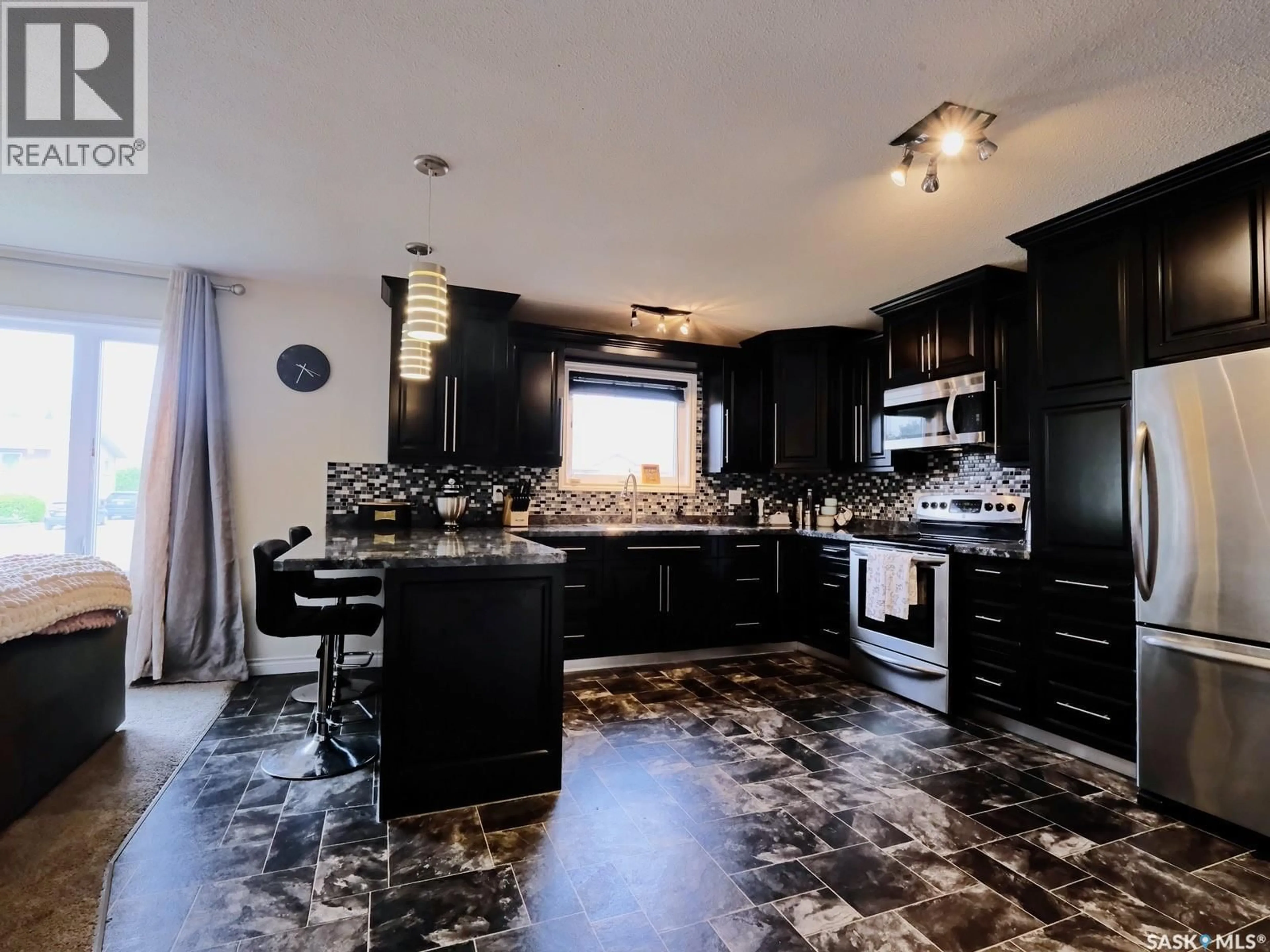 Contemporary kitchen, ceramic/tile floor for 106 8TH AVENUE, Biggar Saskatchewan S0K0M0