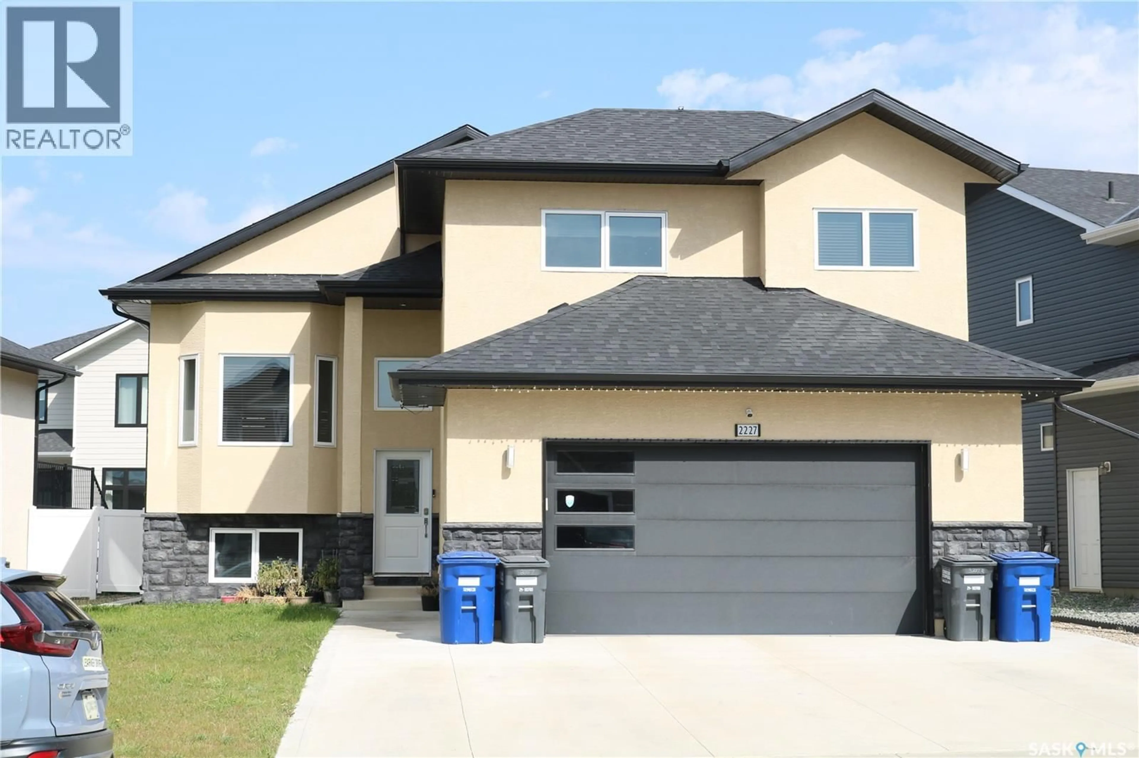 Home with vinyl exterior material, street for 2227 ROSEWOOD DRIVE, Saskatoon Saskatchewan S7V0R9