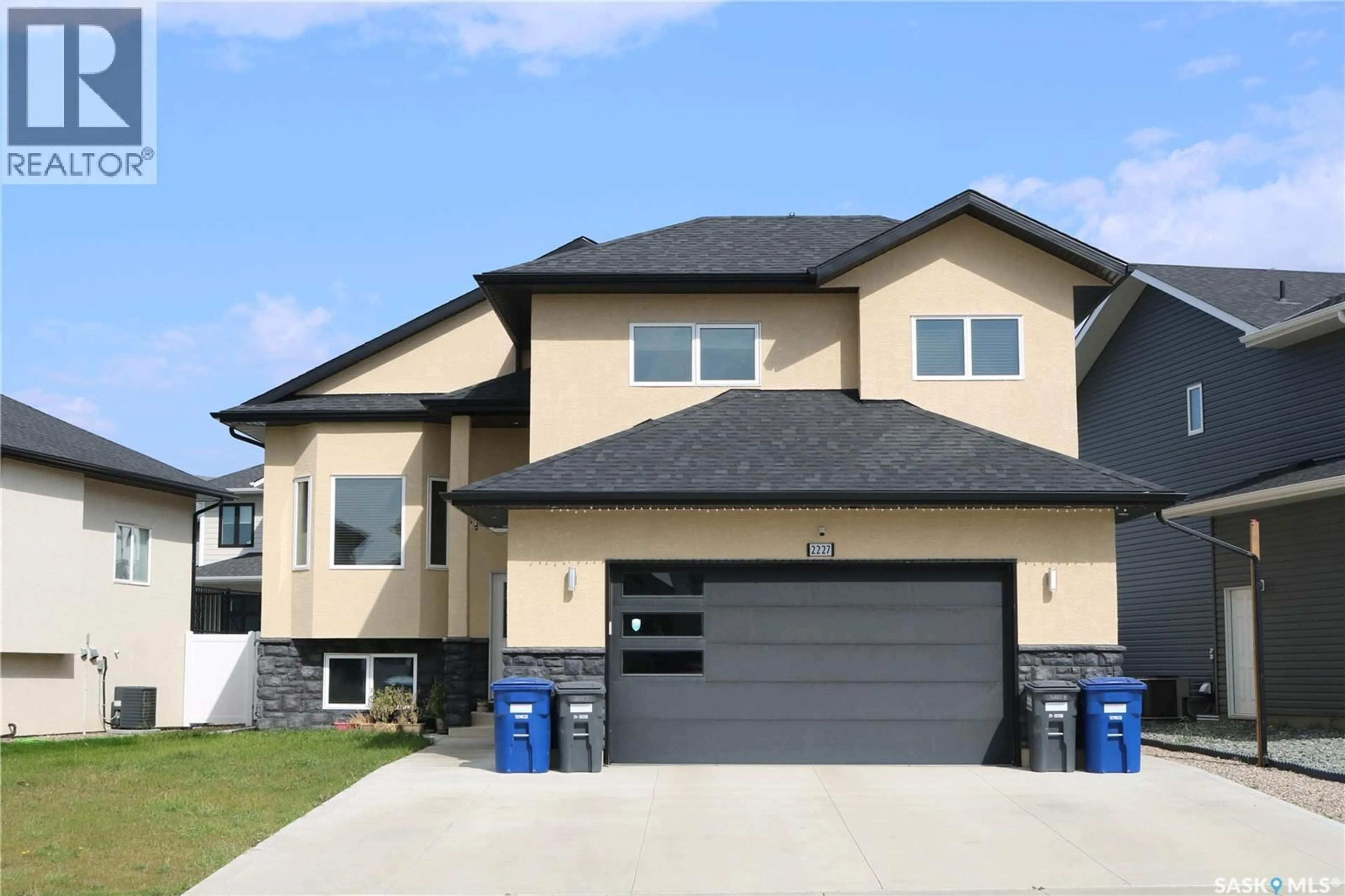 Home with vinyl exterior material, street for 2227 ROSEWOOD DRIVE, Saskatoon Saskatchewan S7V0R9
