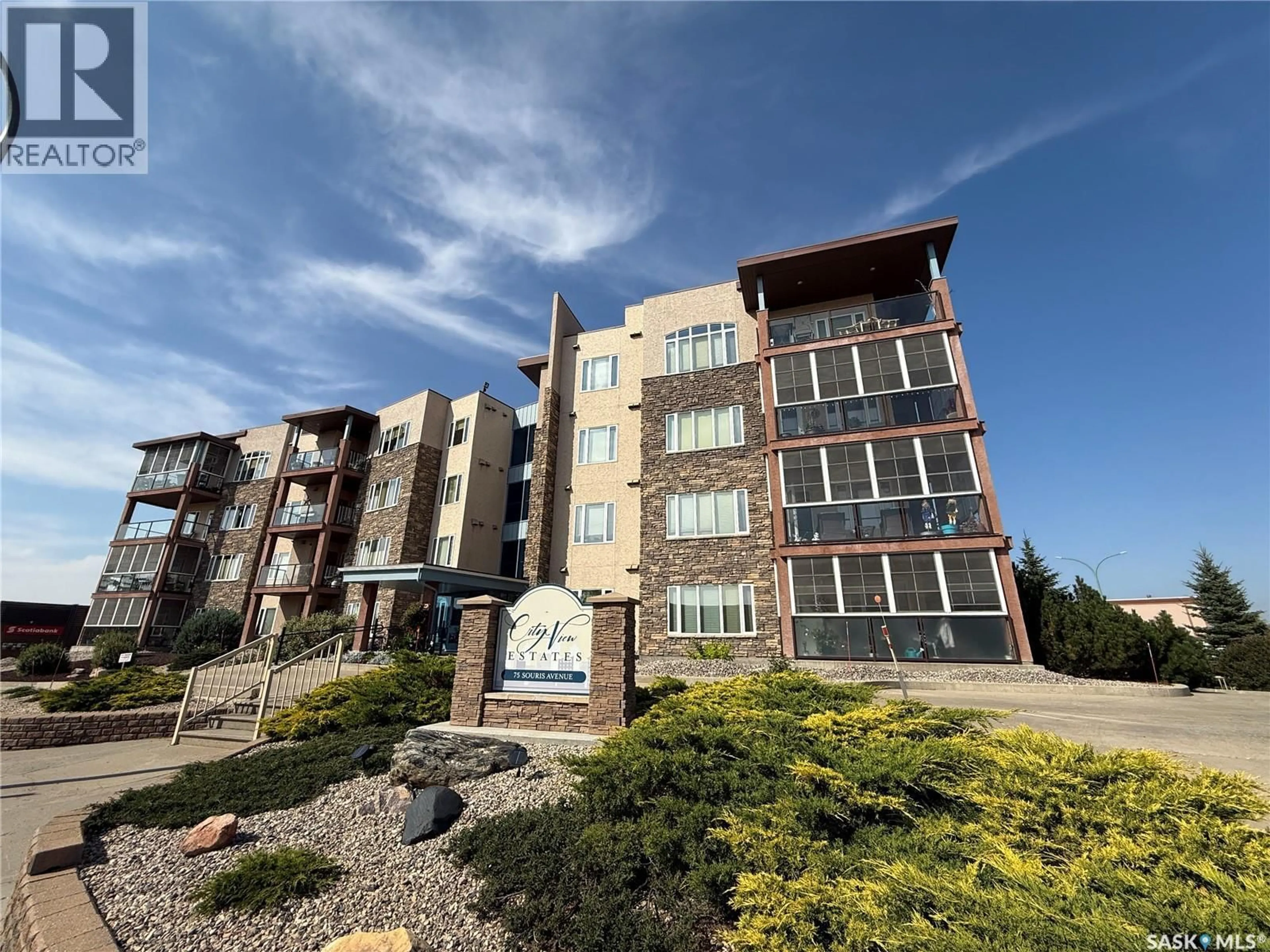 A pic from outside/outdoor area/front of a property/back of a property/a pic from drone, building for 405 75 SOURIS AVENUE, Weyburn Saskatchewan S4H0C1