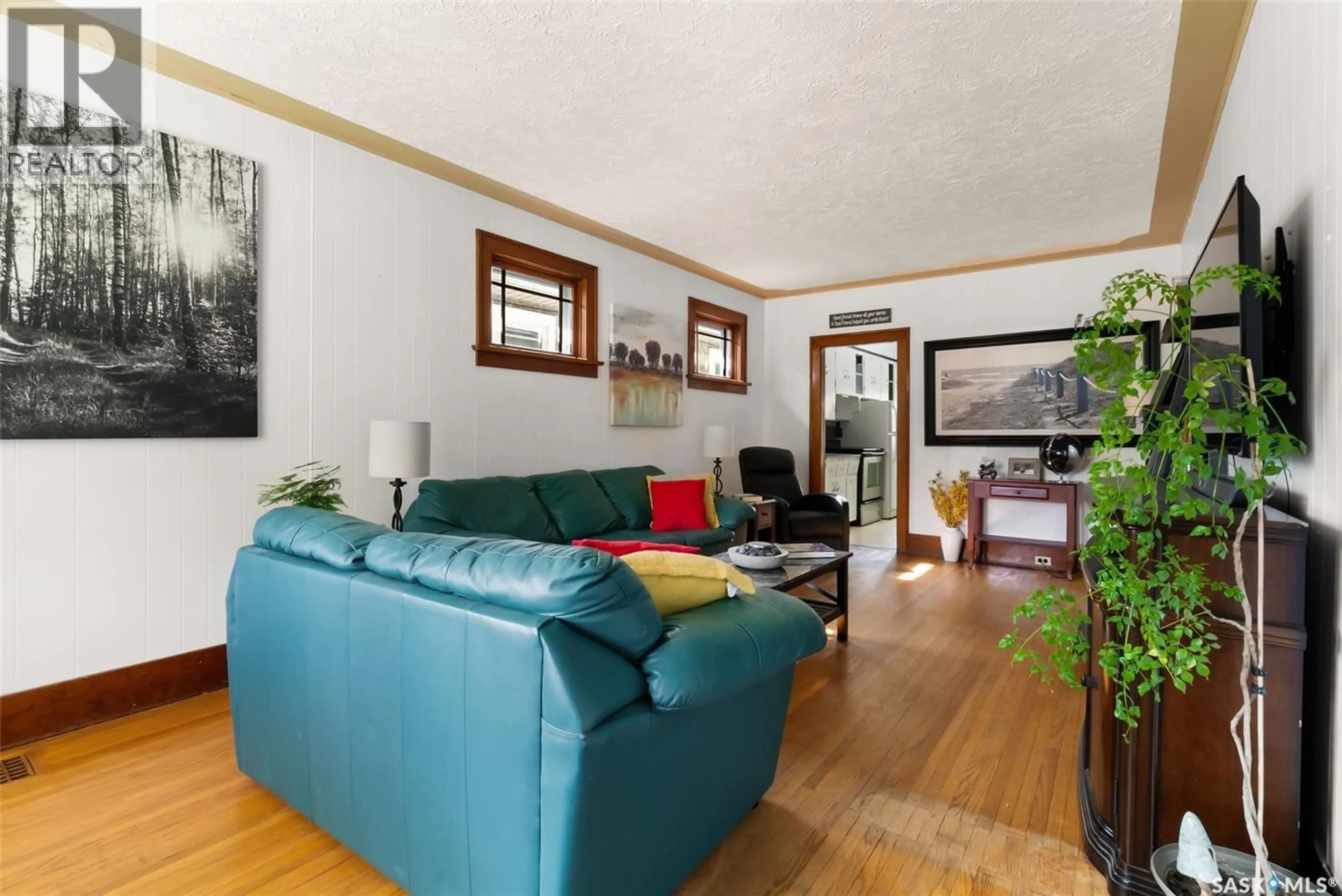 Living room with furniture, wood/laminate floor for 2320 BRODER STREET, Regina Saskatchewan S4N3S8