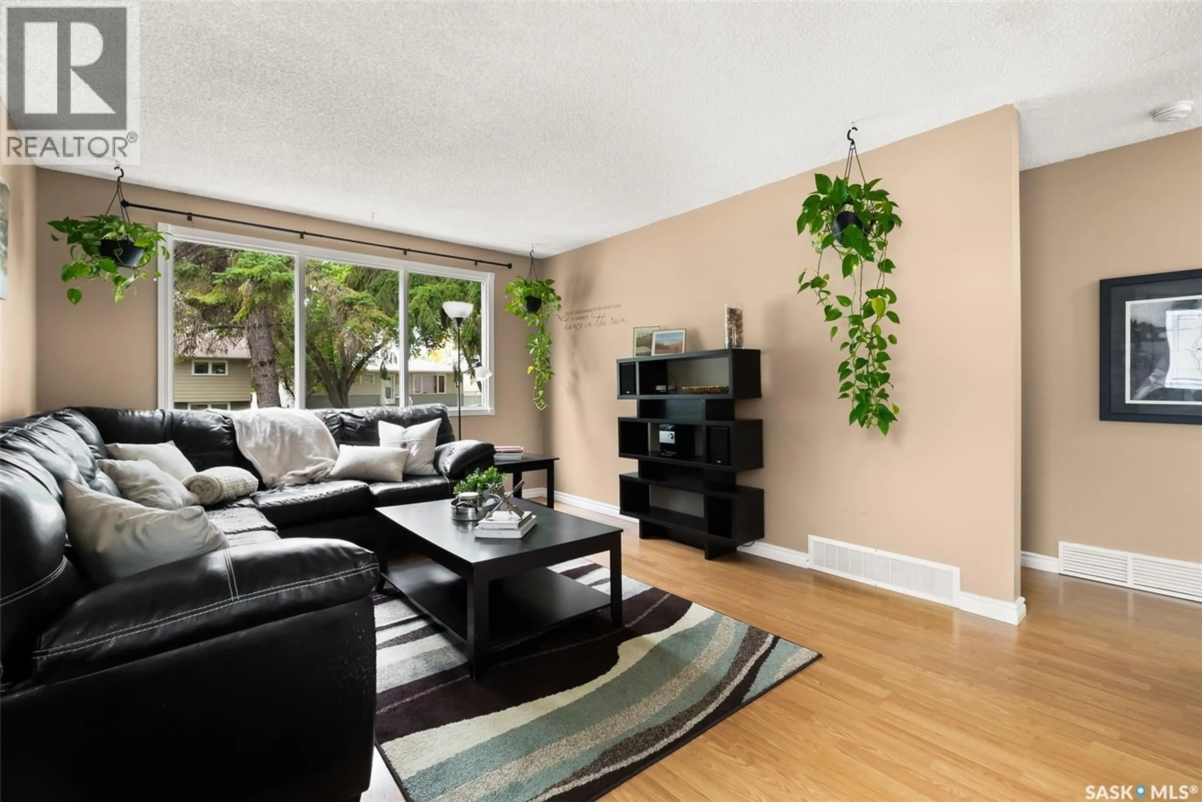 Living room with furniture, unknown for 142 COOPER CRESCENT, Regina Saskatchewan S4R4J7