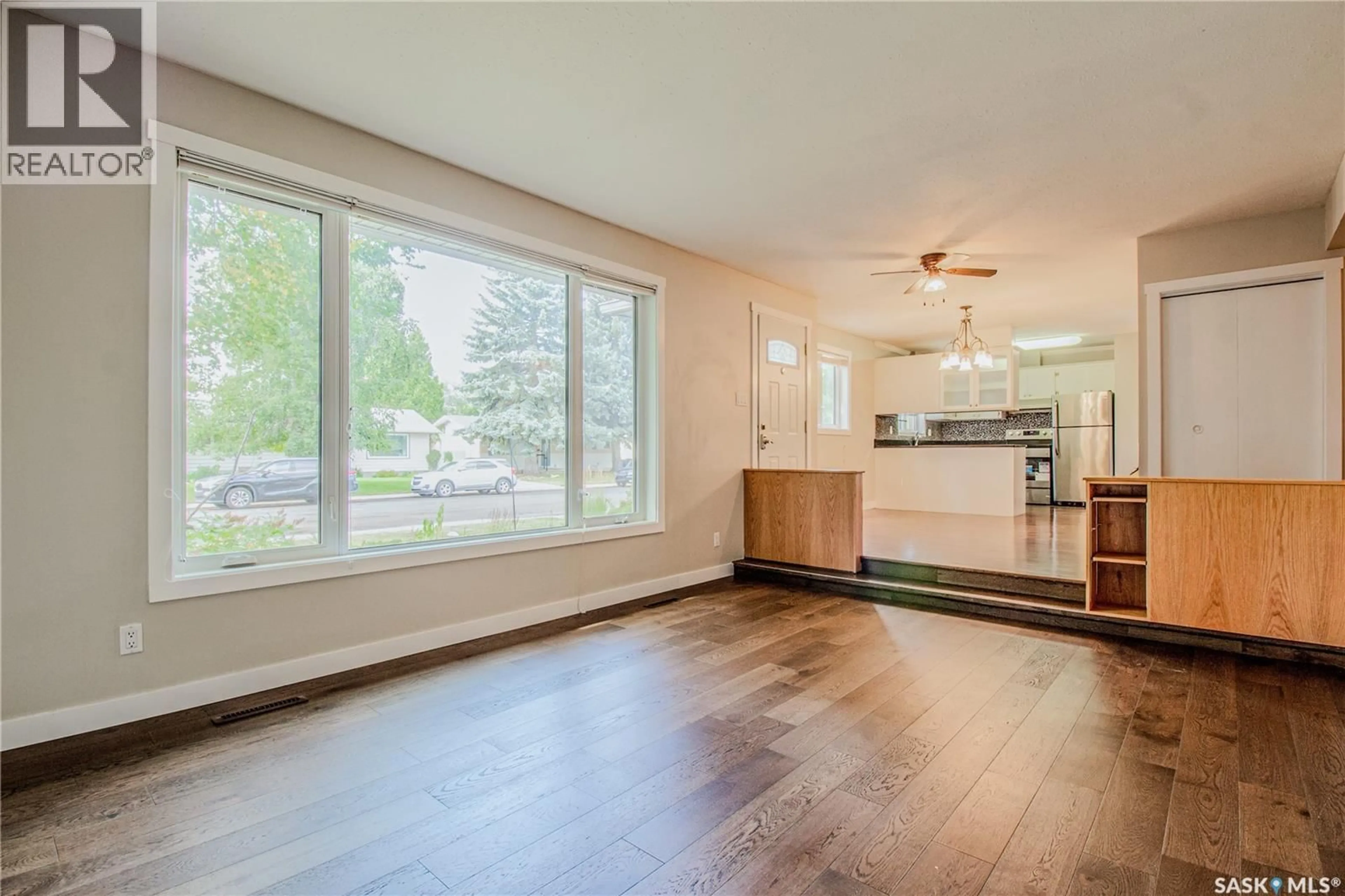 Open concept kitchen, wood/laminate floor for 61 SPARLING CRESCENT, Saskatoon Saskatchewan S7H3M1