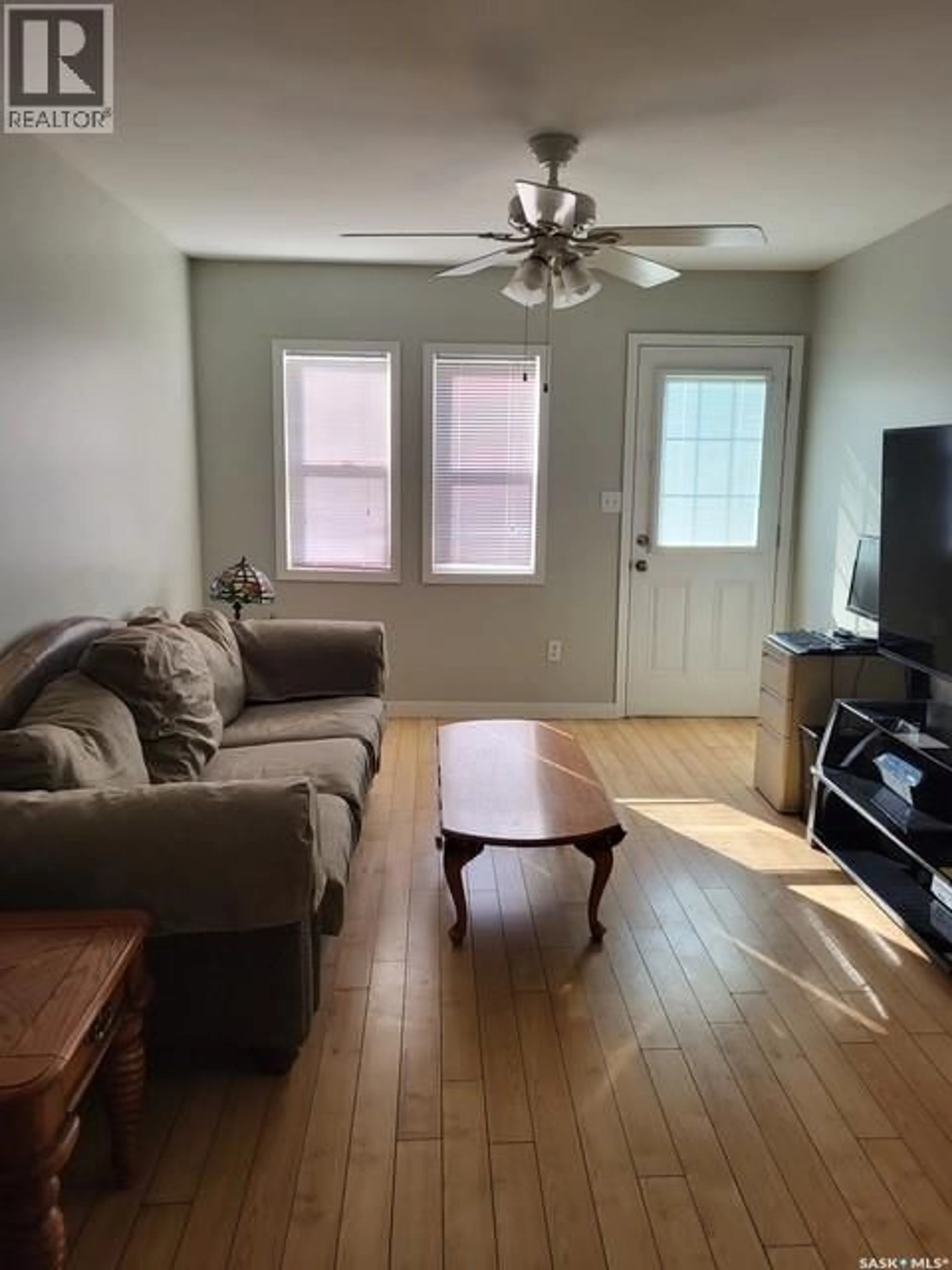 Living room with furniture, wood/laminate floor for 2337 MCDONALD STREET, Regina Saskatchewan S4N2Z2
