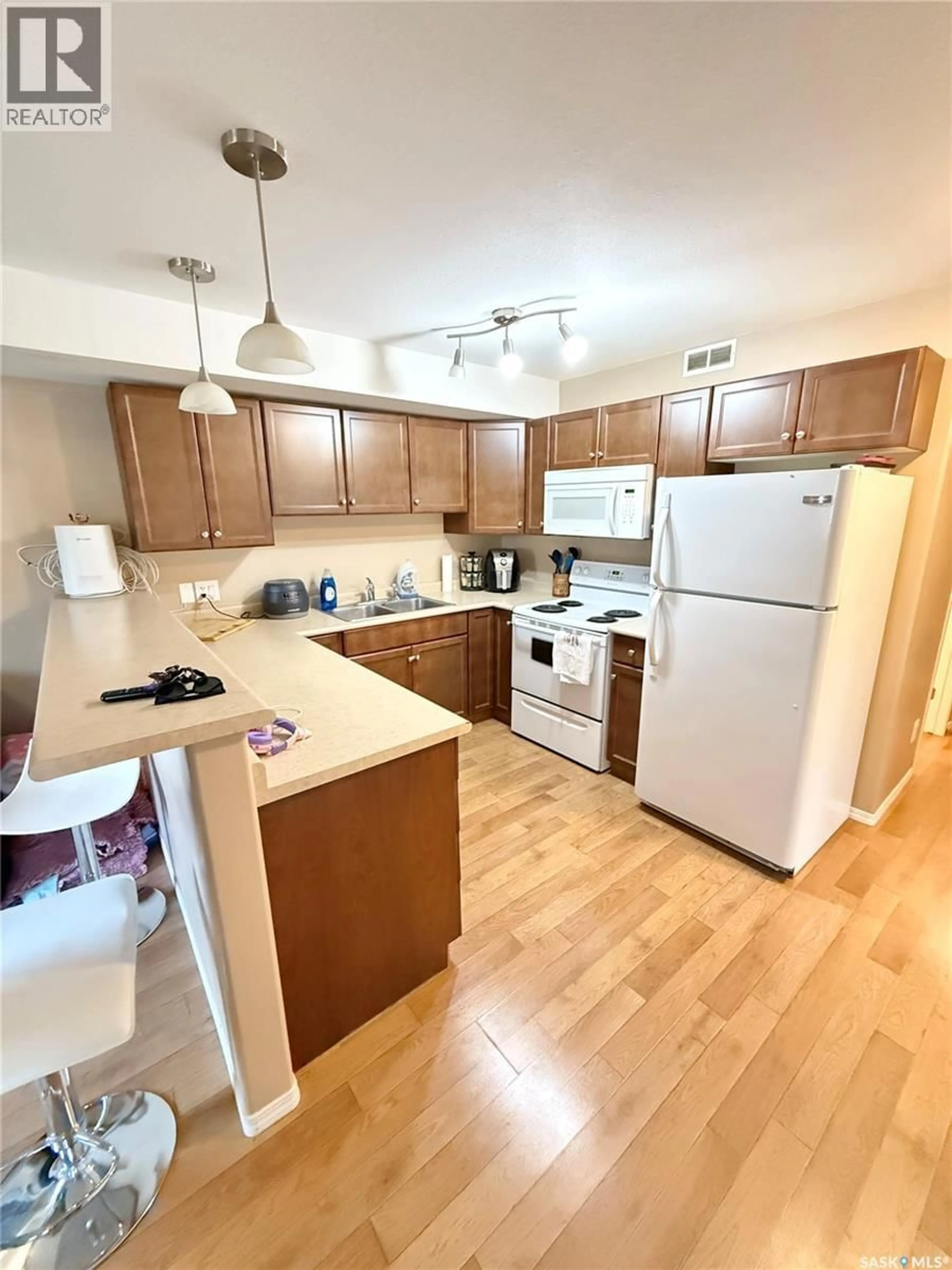 Standard kitchen, wood/laminate floor for 101 - 1638 CLARK AVENUE, Weyburn Saskatchewan S4H3G3