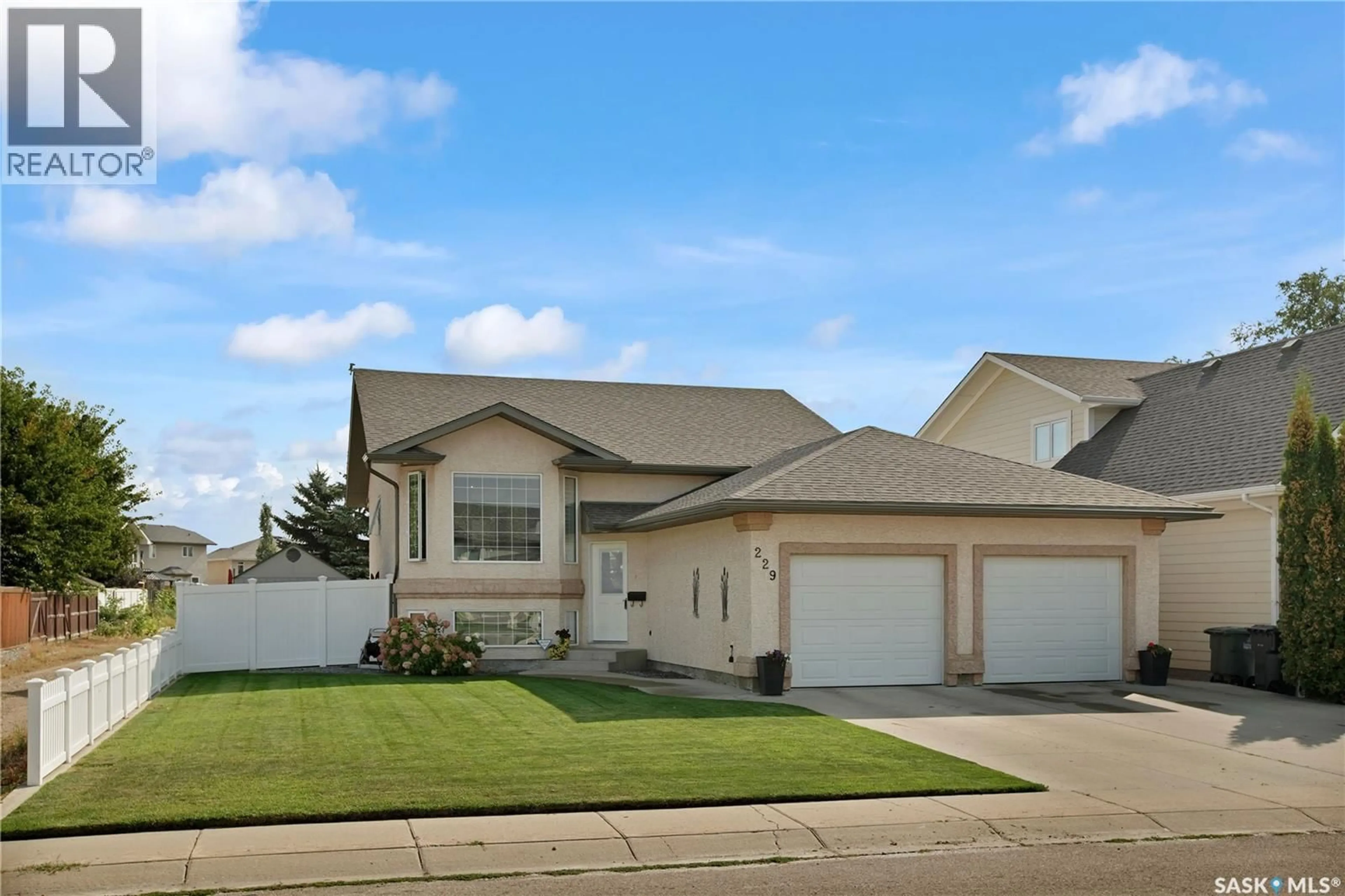 Home with vinyl exterior material, street for 229 LAKERIDGE DRIVE, Warman Saskatchewan S0K0A1