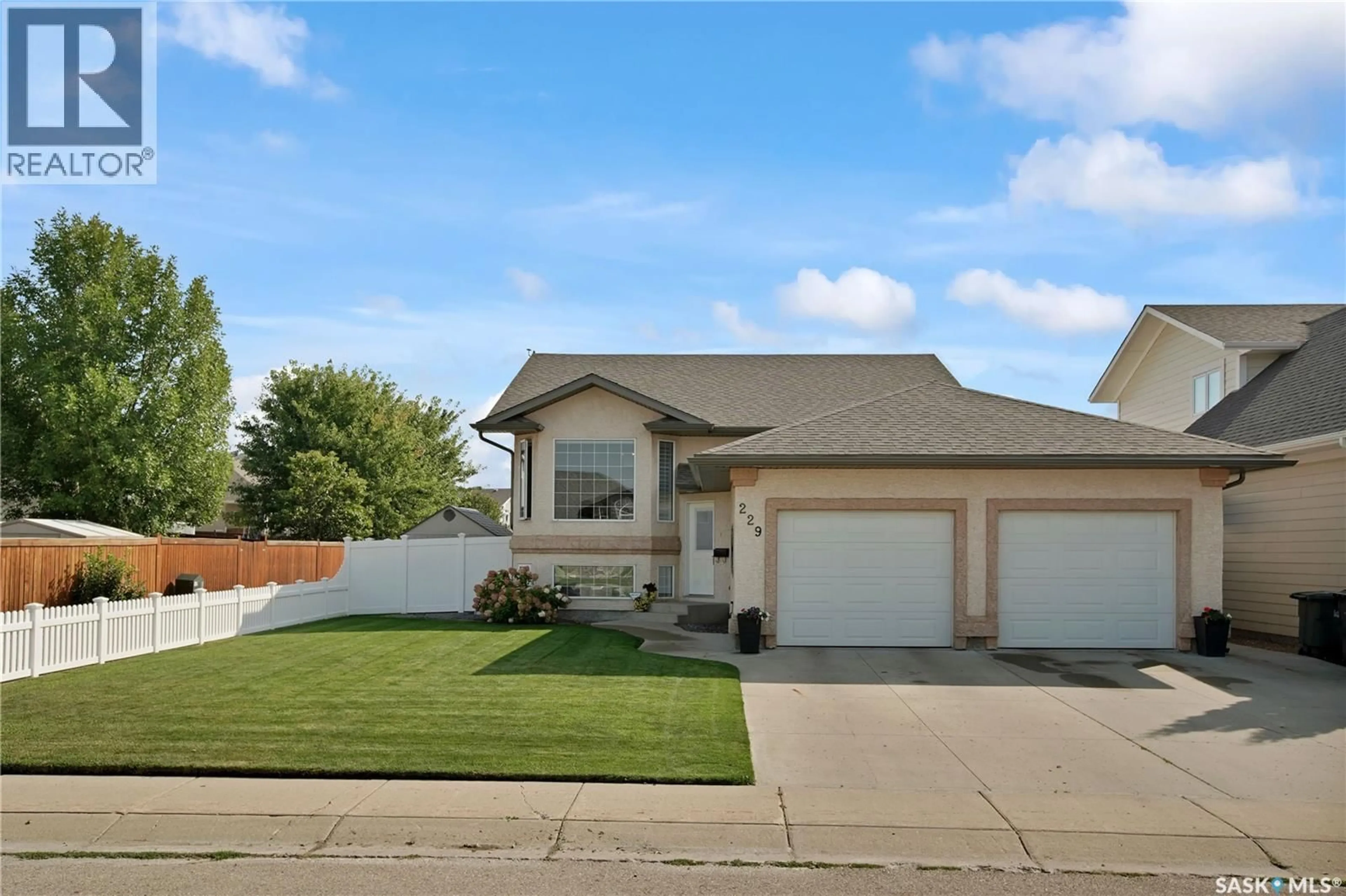 Home with vinyl exterior material, street for 229 LAKERIDGE DRIVE, Warman Saskatchewan S0K0A1