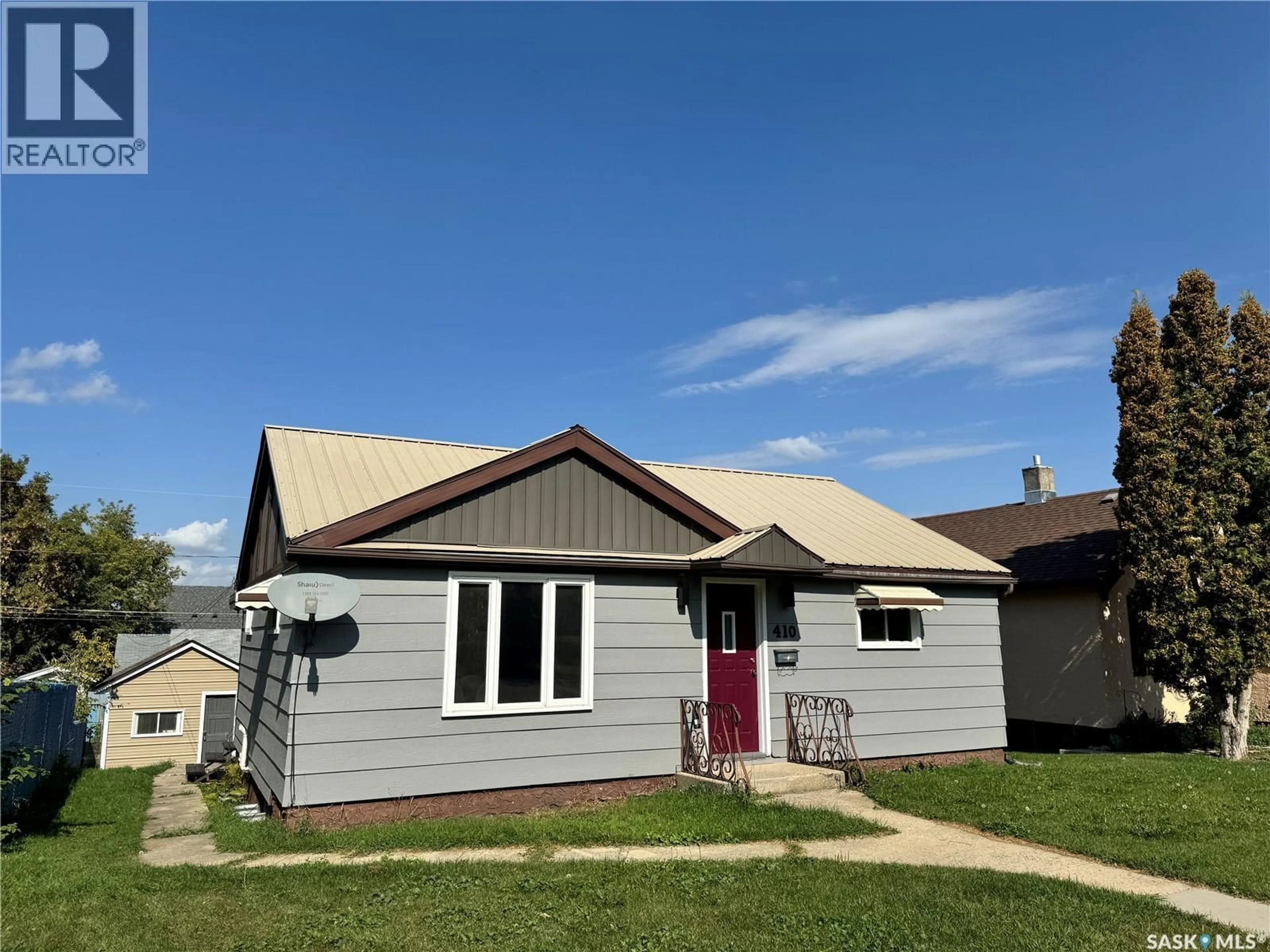 Home with vinyl exterior material, street for 410 20TH STREET, Prince Albert Saskatchewan S6V1L1