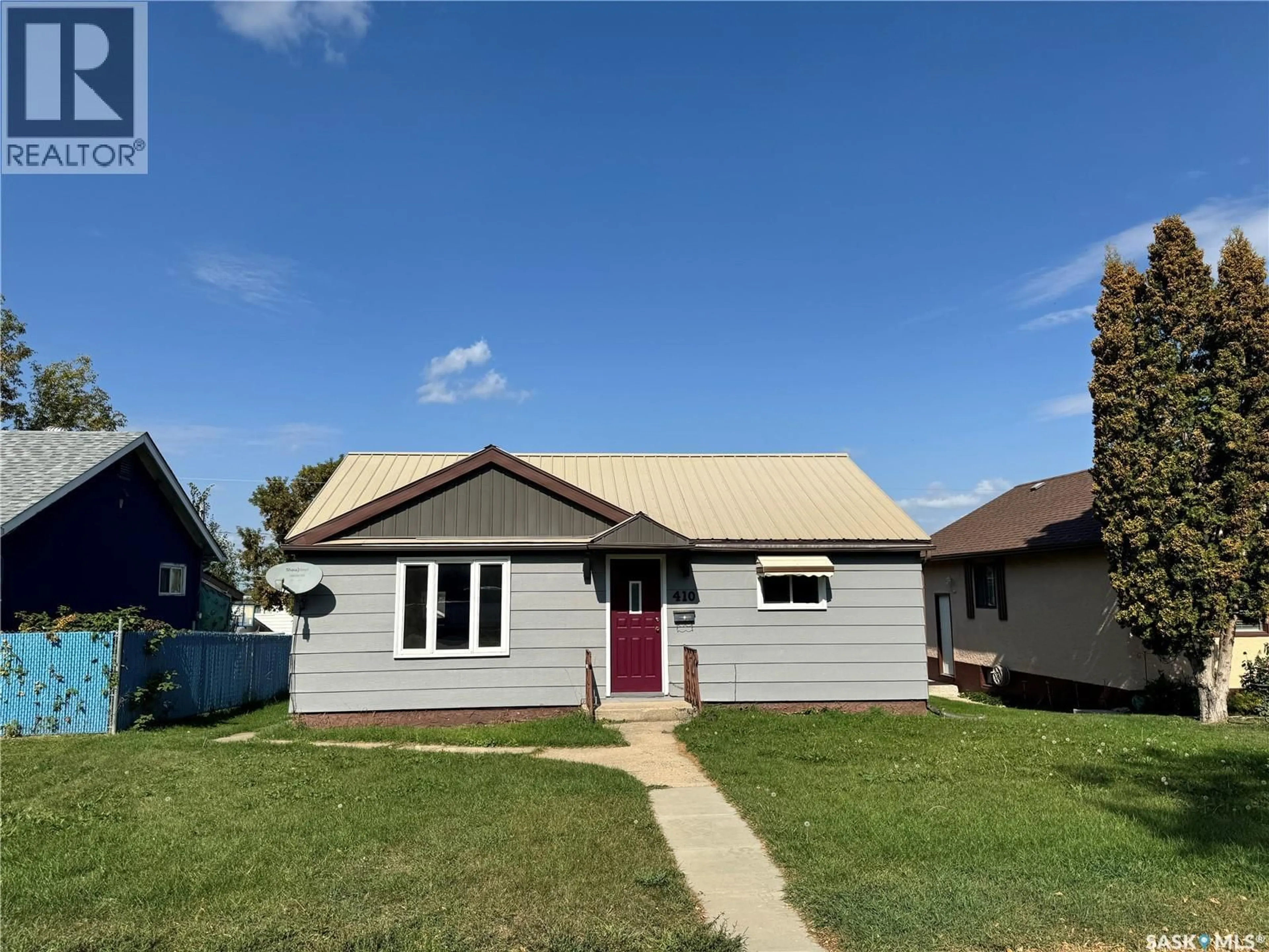 Home with vinyl exterior material, street for 410 20TH STREET, Prince Albert Saskatchewan S6V1L1