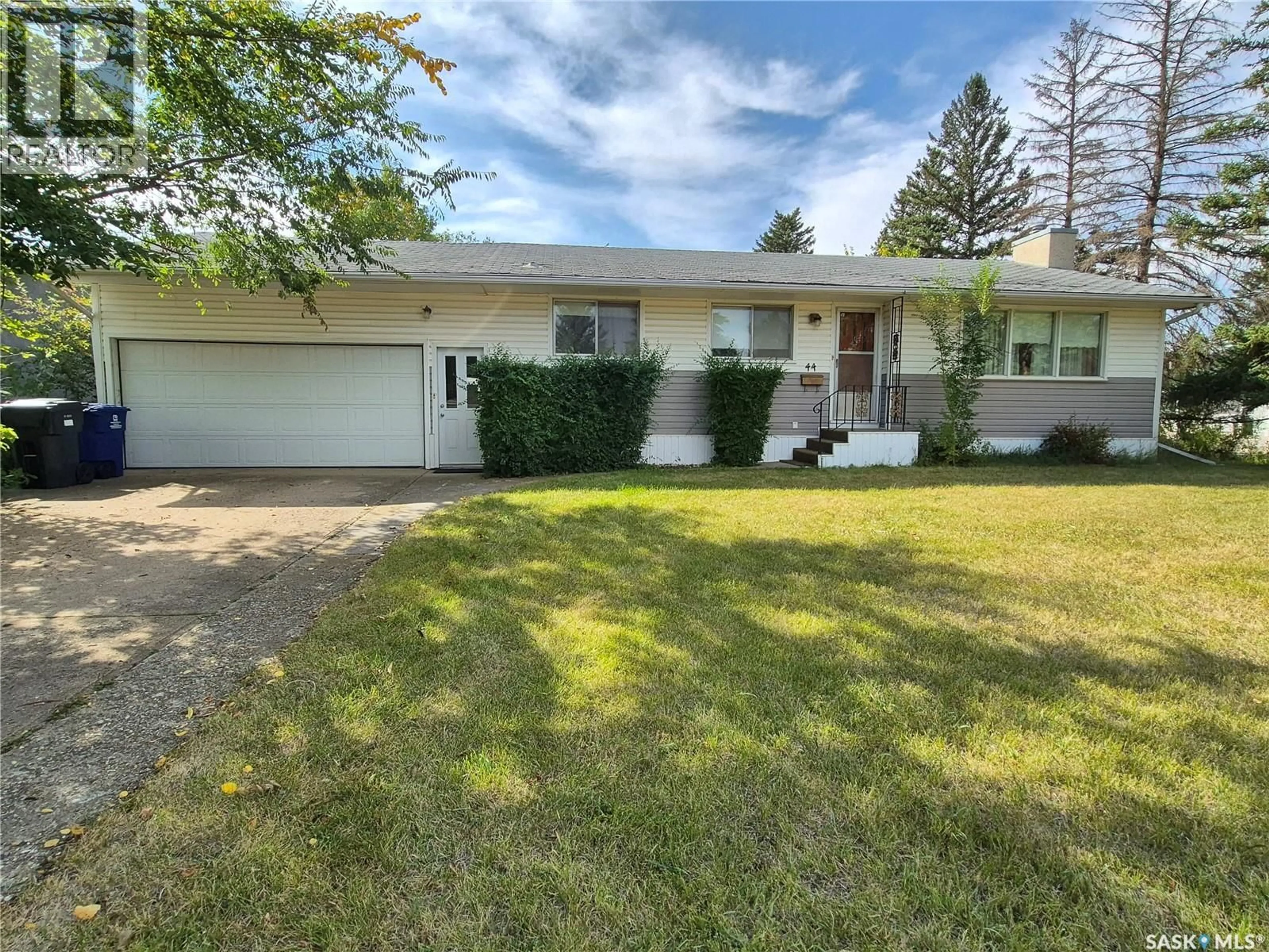 Home with vinyl exterior material, street for 44 ASH DRIVE, Weyburn Saskatchewan S4H0S1