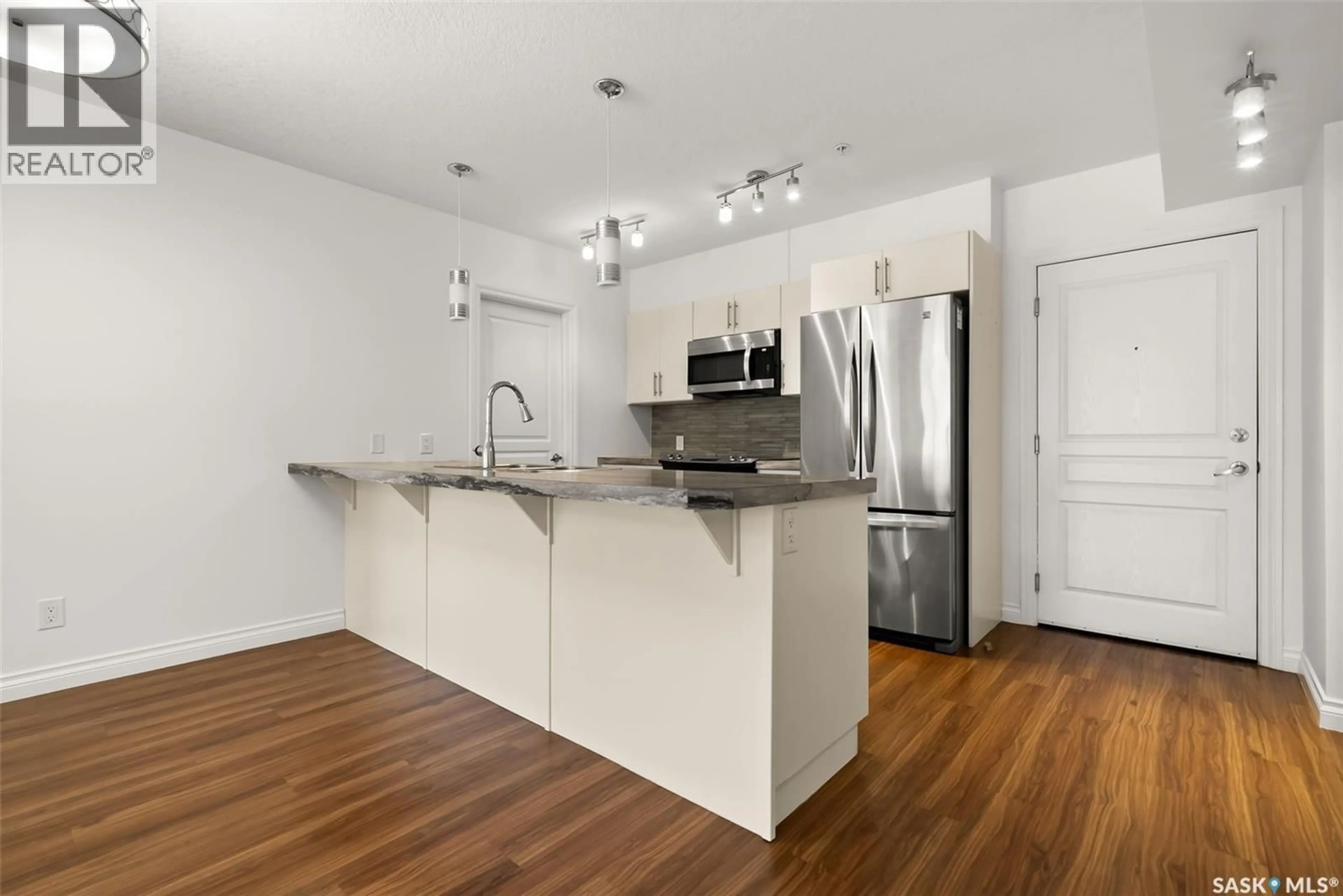 Open concept kitchen, unknown for 123 5303 UNIVERSAL CRESCENT, Regina Saskatchewan S4W0L1