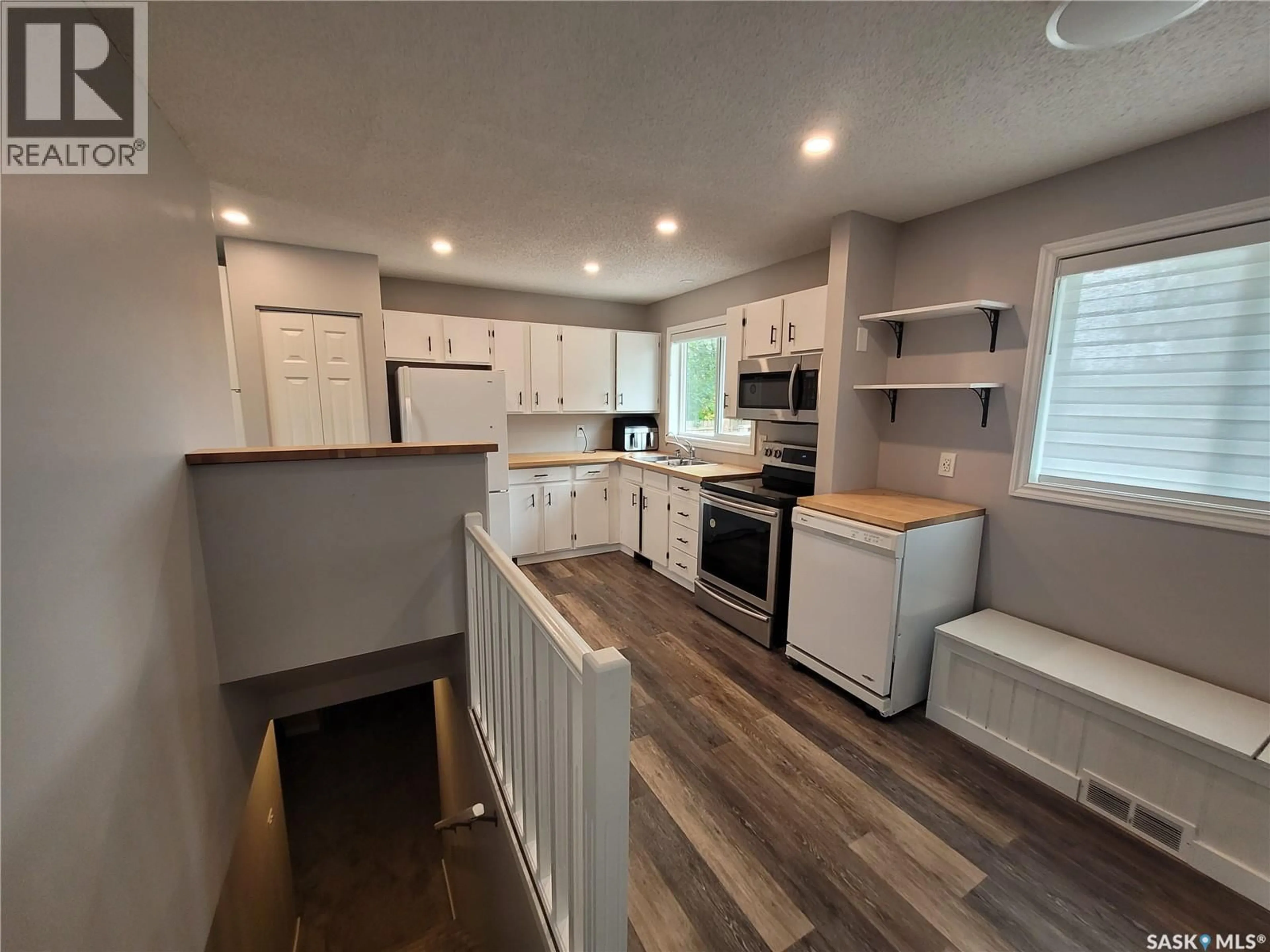 Open concept kitchen, wood/laminate floor for 303 WALL STREET, Dalmeny Saskatchewan S0K1E0