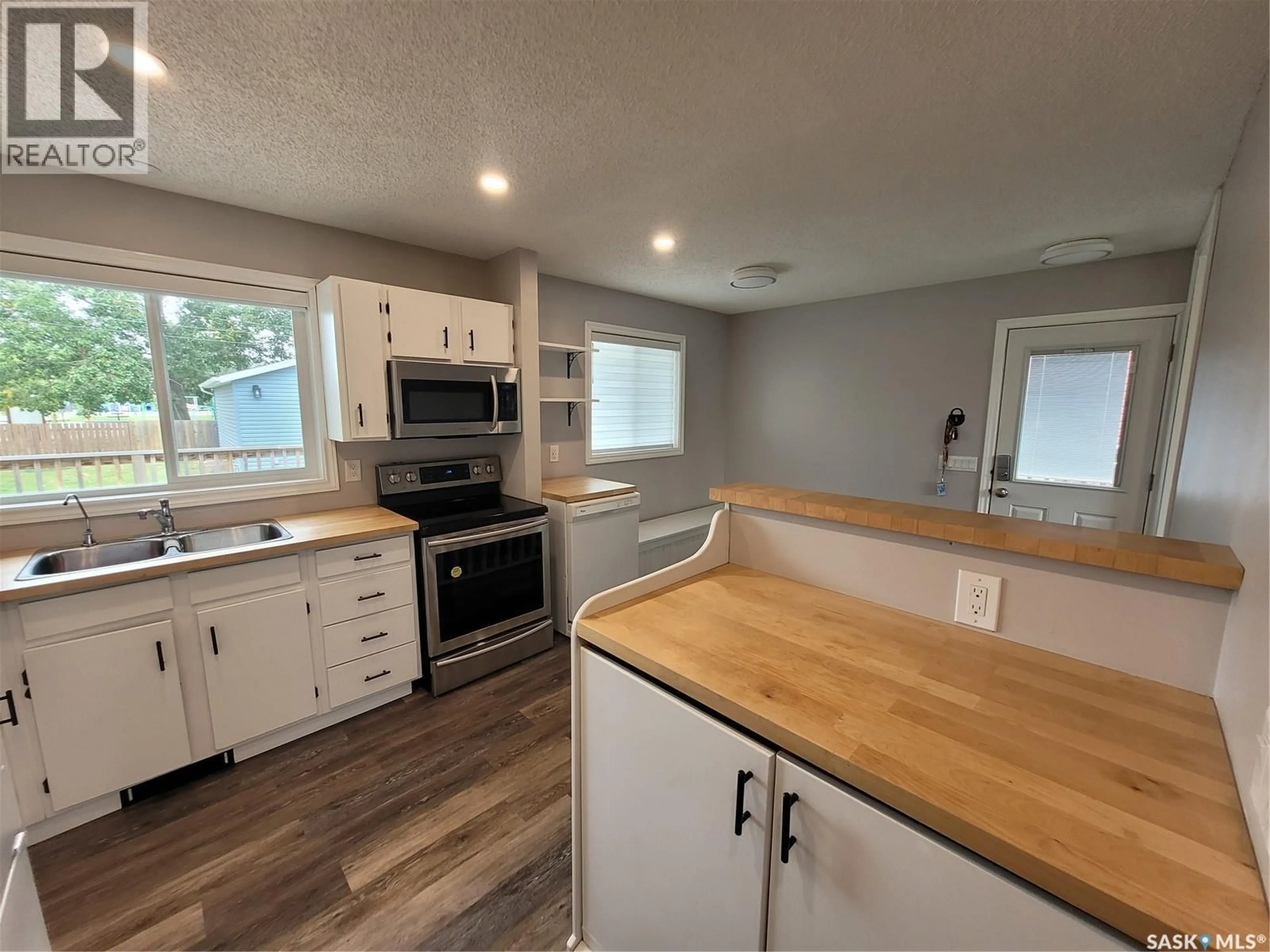 Open concept kitchen, wood/laminate floor for 303 WALL STREET, Dalmeny Saskatchewan S0K1E0