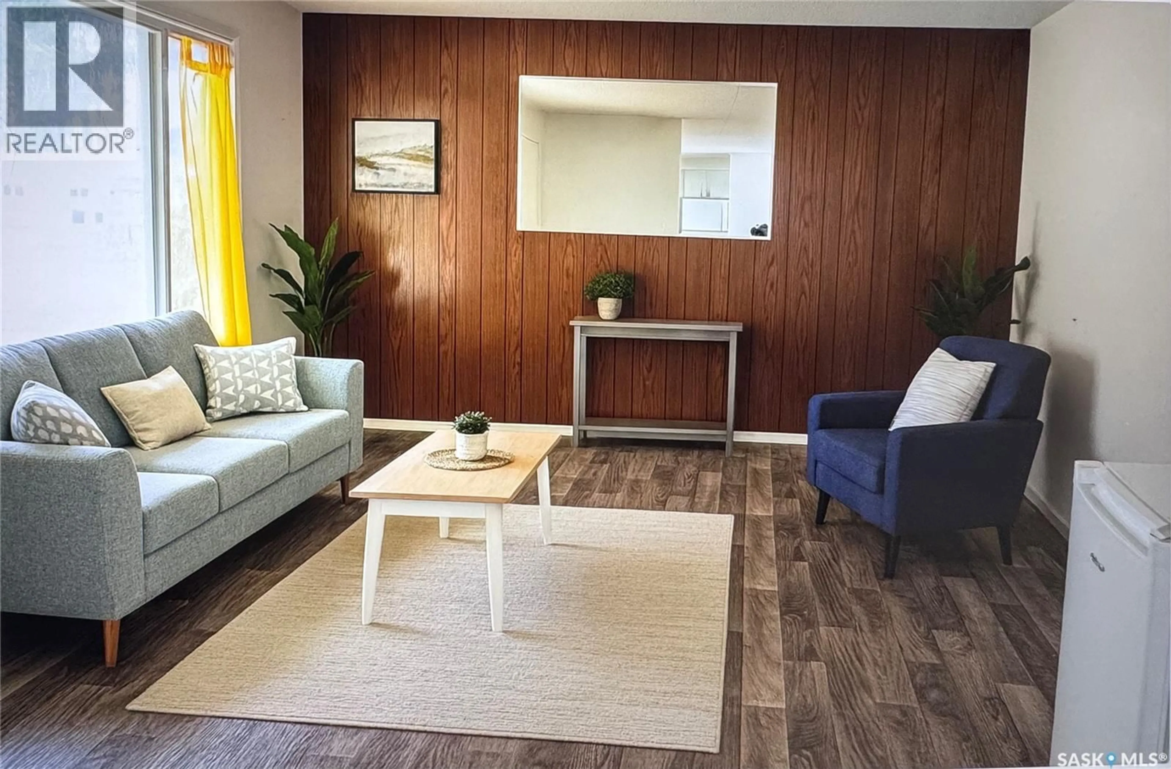 Living room with furniture, wood/laminate floor for 917 GALT STREET, Whitewood Saskatchewan S0G5C0