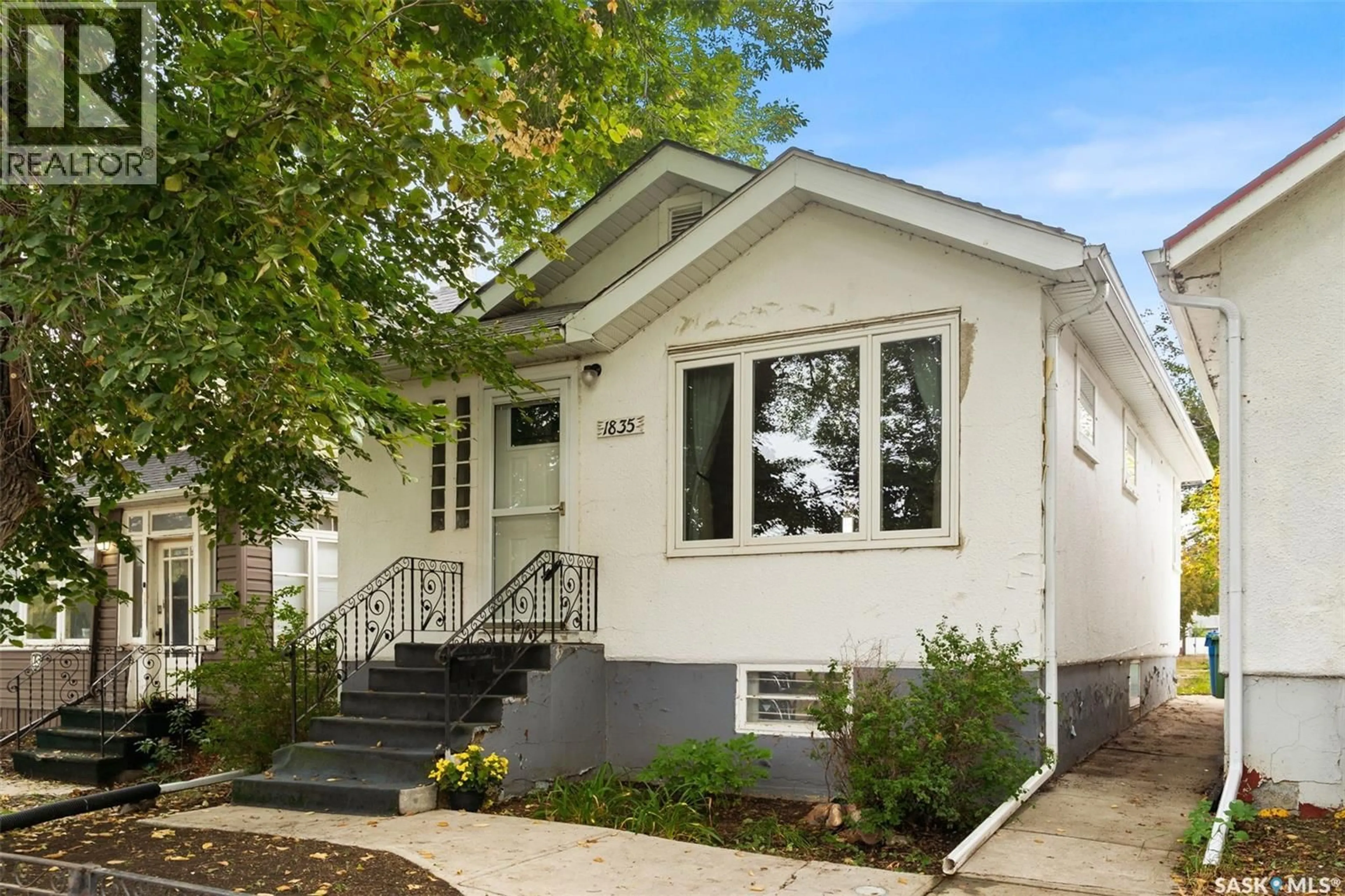 Home with vinyl exterior material, street for 1835 QUEBEC STREET, Regina Saskatchewan S4P1J6