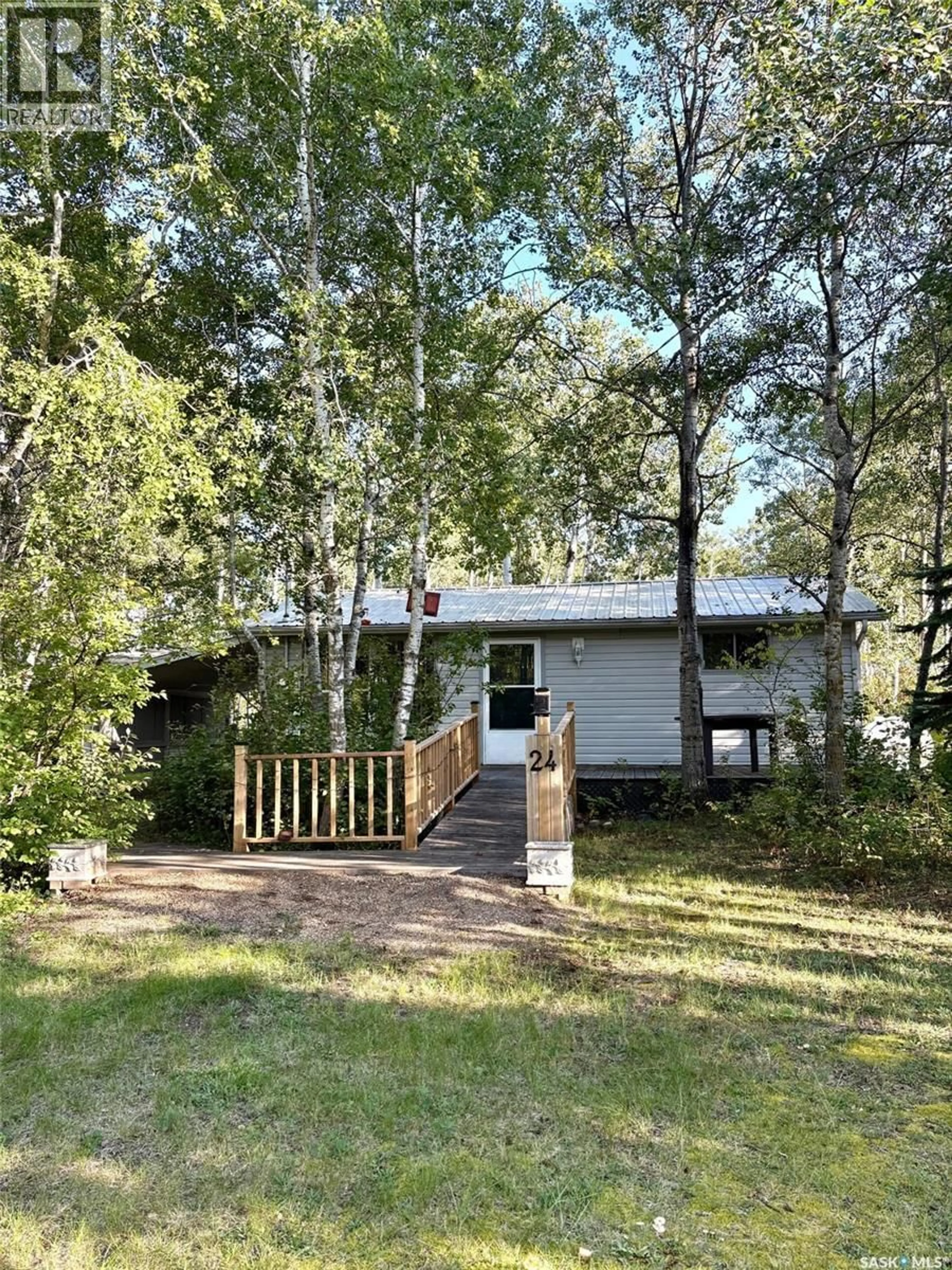 Home with vinyl exterior material, forest/trees view for 24 WILLOW CRESCENT, Good Lake Rm No. 274 Saskatchewan S0A3V0