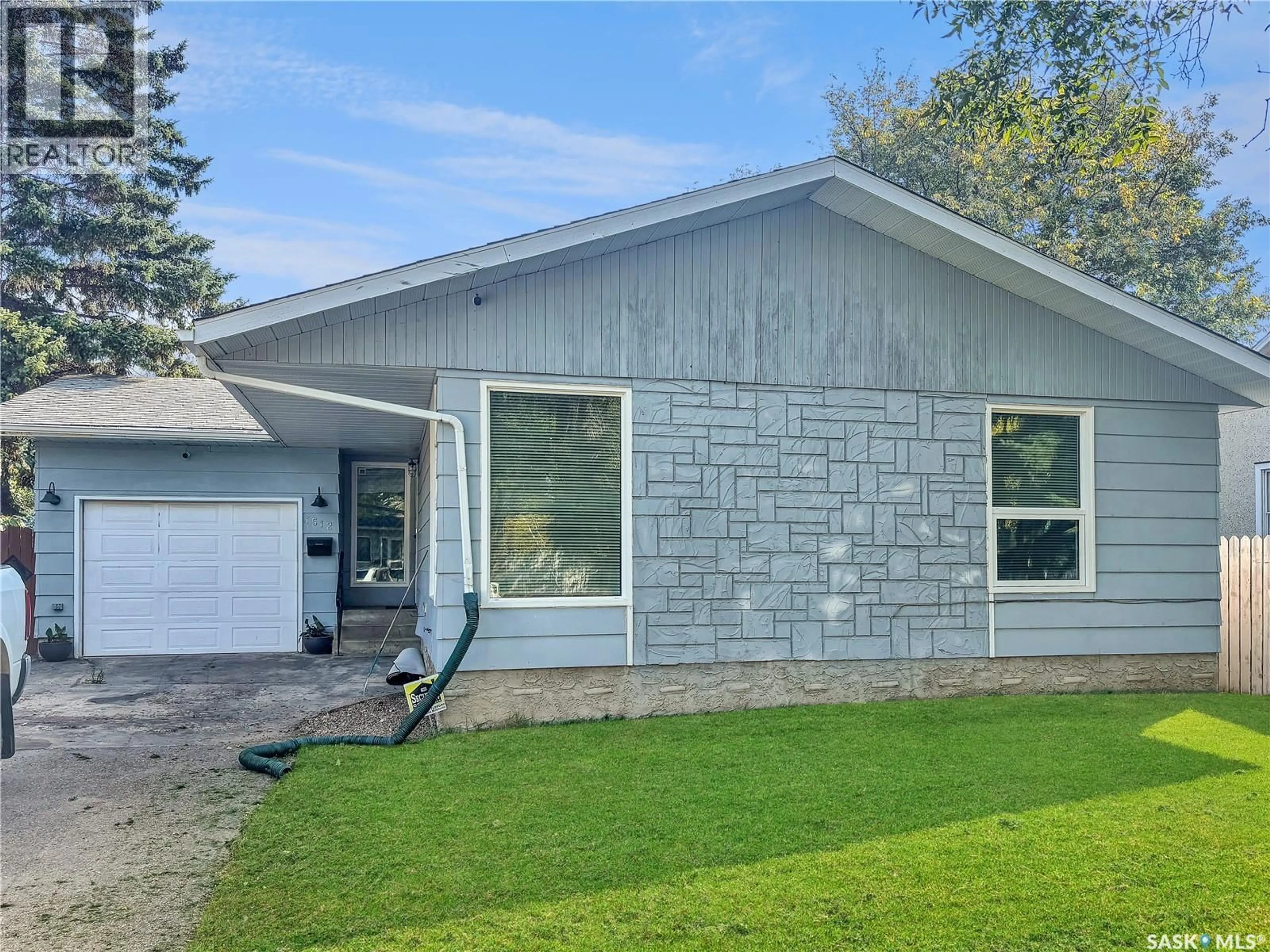 Home with vinyl exterior material, street for 1512 104TH  STREET, North Battleford Saskatchewan S9A1P5