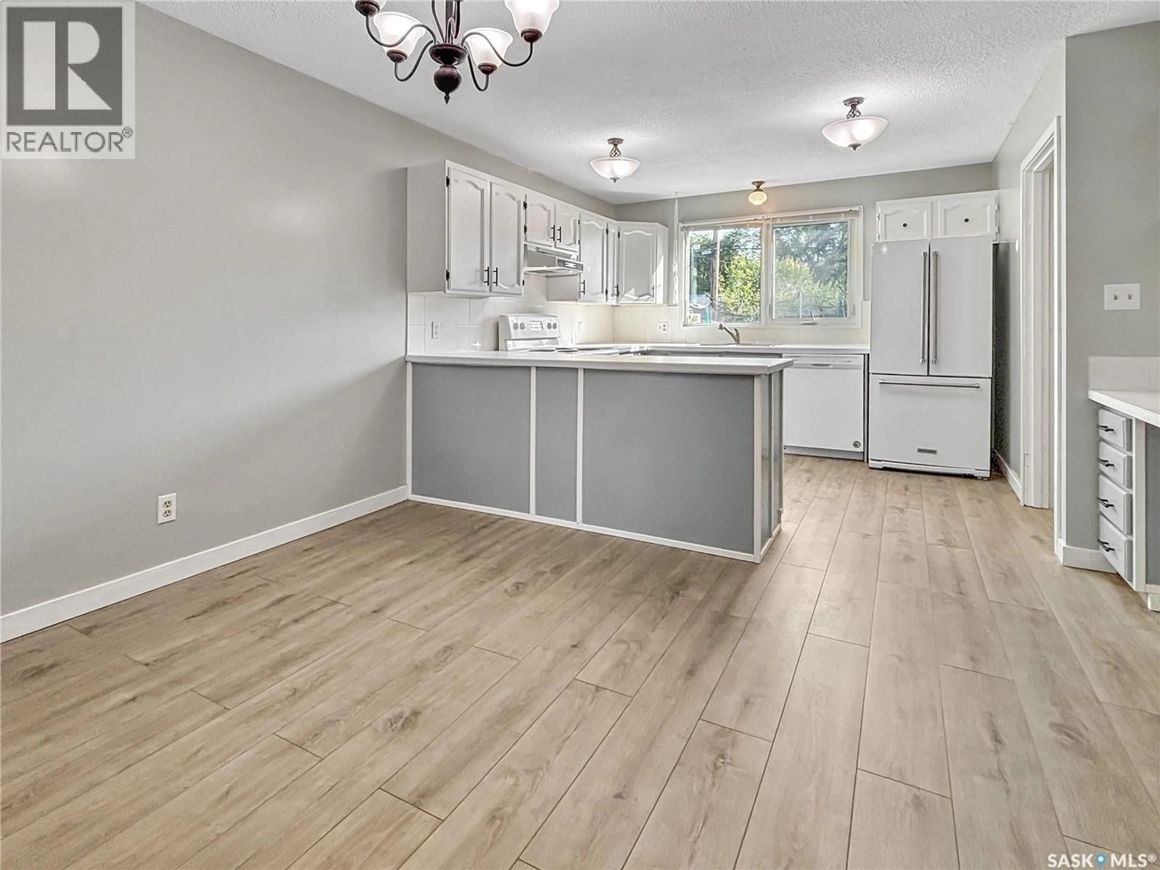 Open concept kitchen, wood/laminate floor for 1512 104TH  STREET, North Battleford Saskatchewan S9A1P5