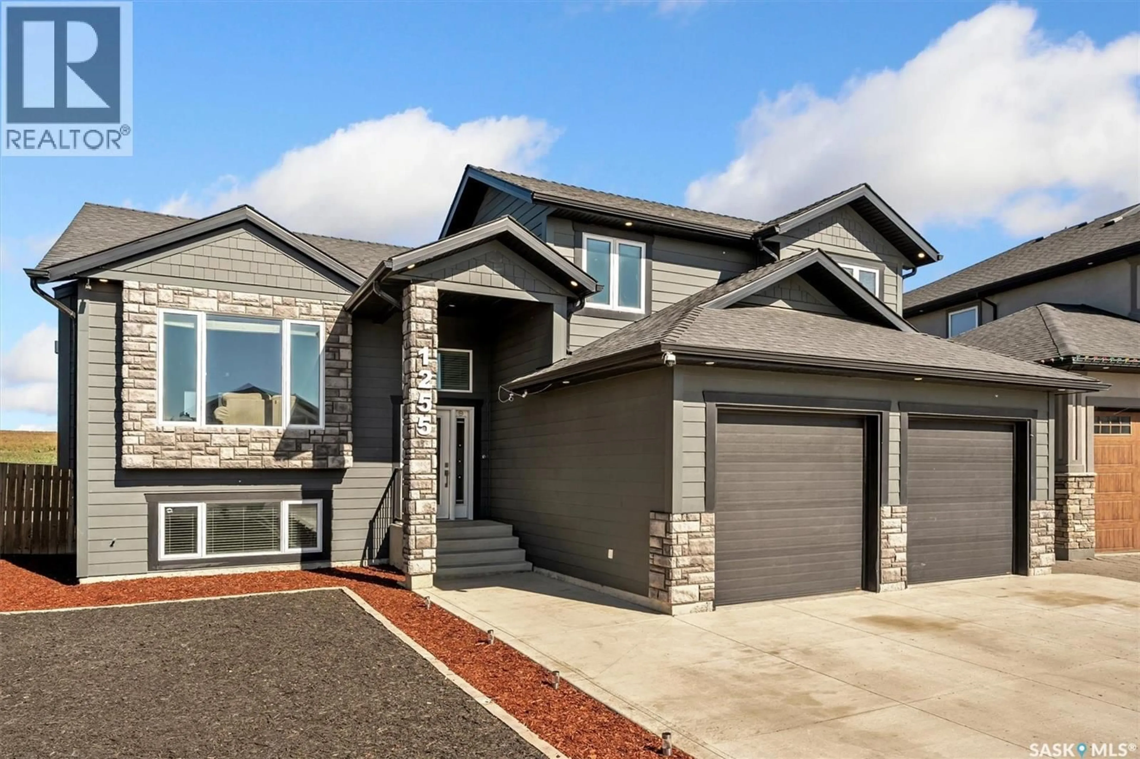 Home with brick exterior material, street for 1255 HARGREAVES WAY, Saskatoon Saskatchewan S7L0A1