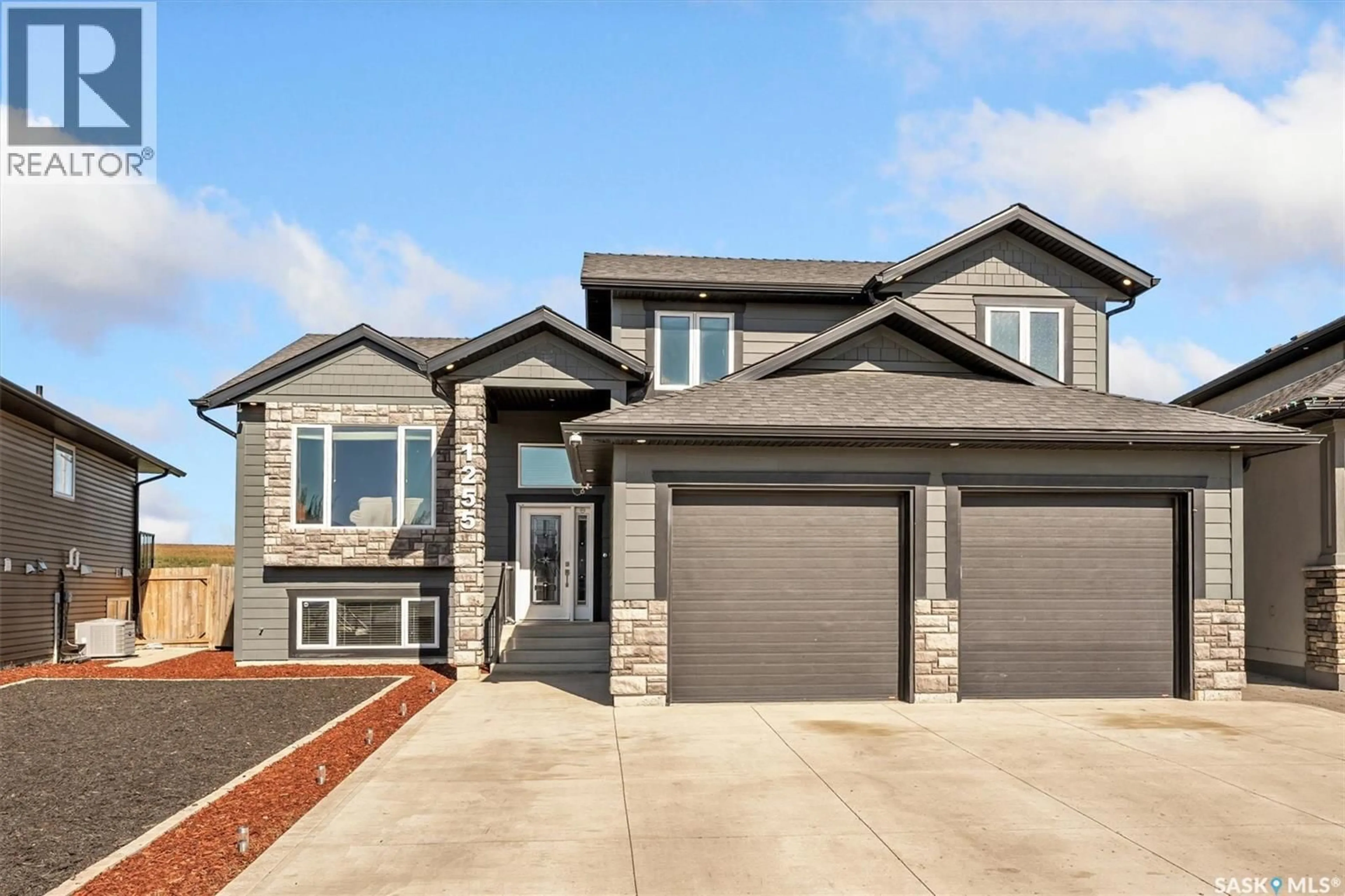 Home with brick exterior material, street for 1255 HARGREAVES WAY, Saskatoon Saskatchewan S7L0A1