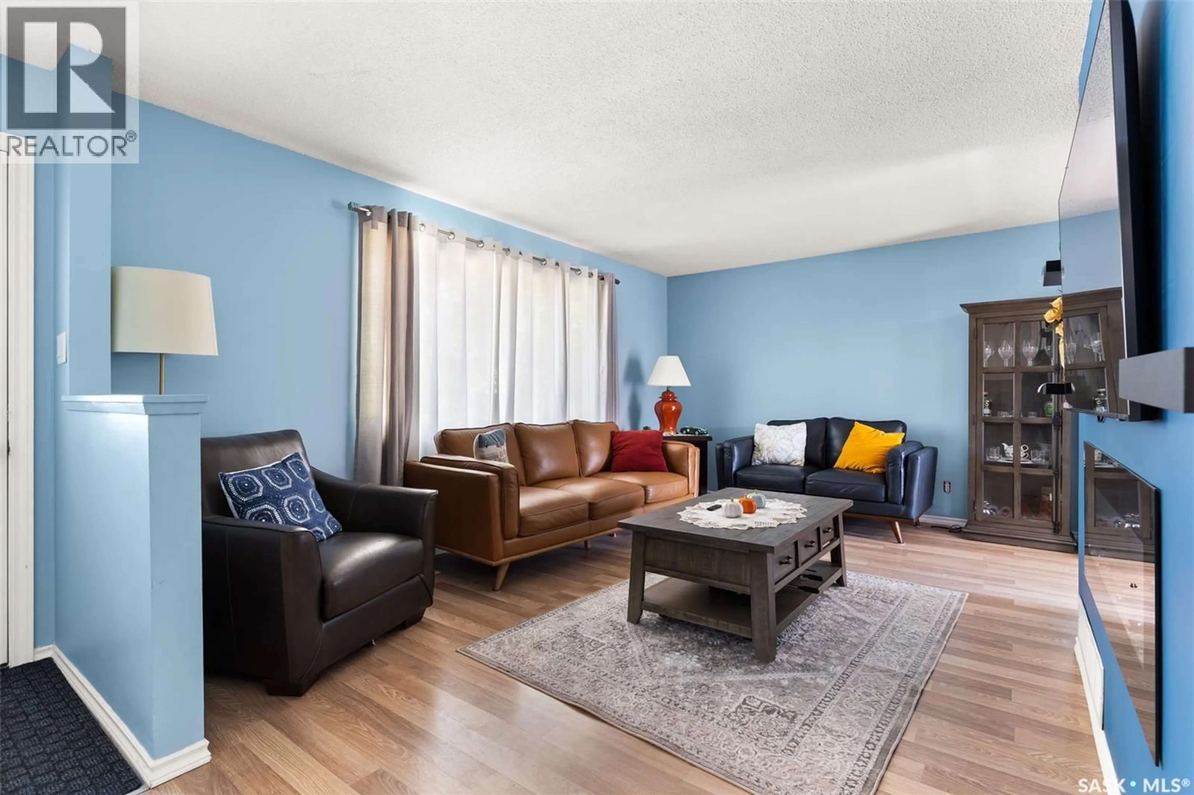 Living room with furniture, wood/laminate floor for 1341 9TH AVENUE, Regina Saskatchewan S4R0E6