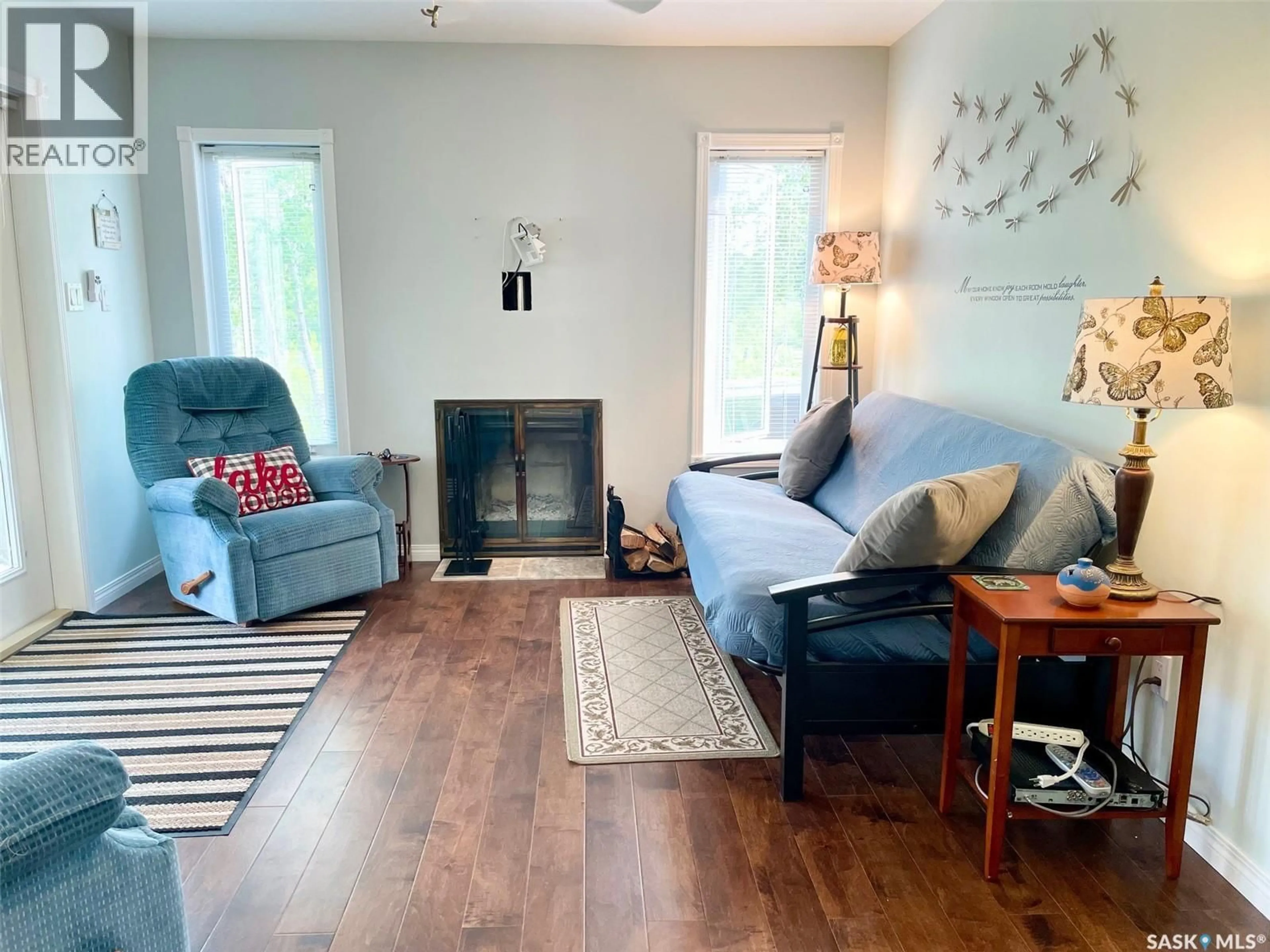 Living room with furniture, wood/laminate floor for 311 SANDY CRESCENT, Good Spirit Lake Saskatchewan S0A0L0