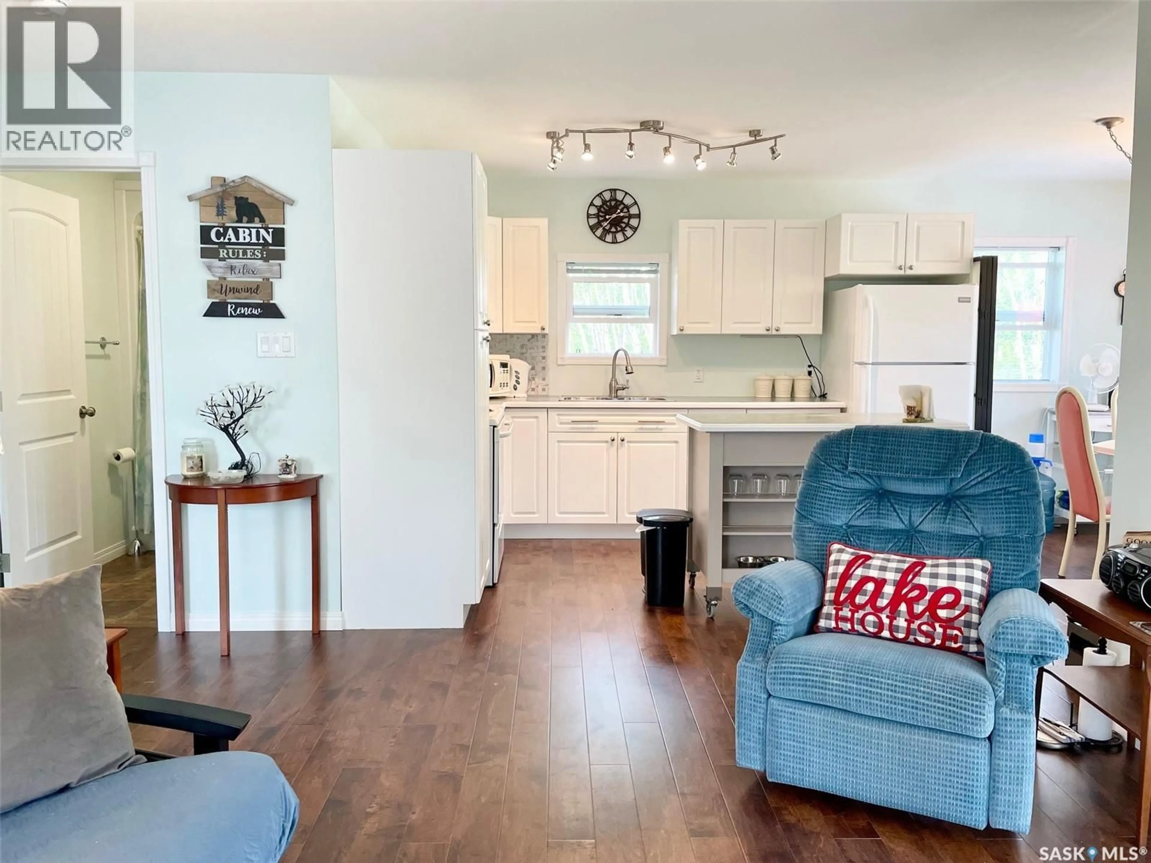 Open concept kitchen, wood/laminate floor for 311 SANDY CRESCENT, Good Spirit Lake Saskatchewan S0A0L0