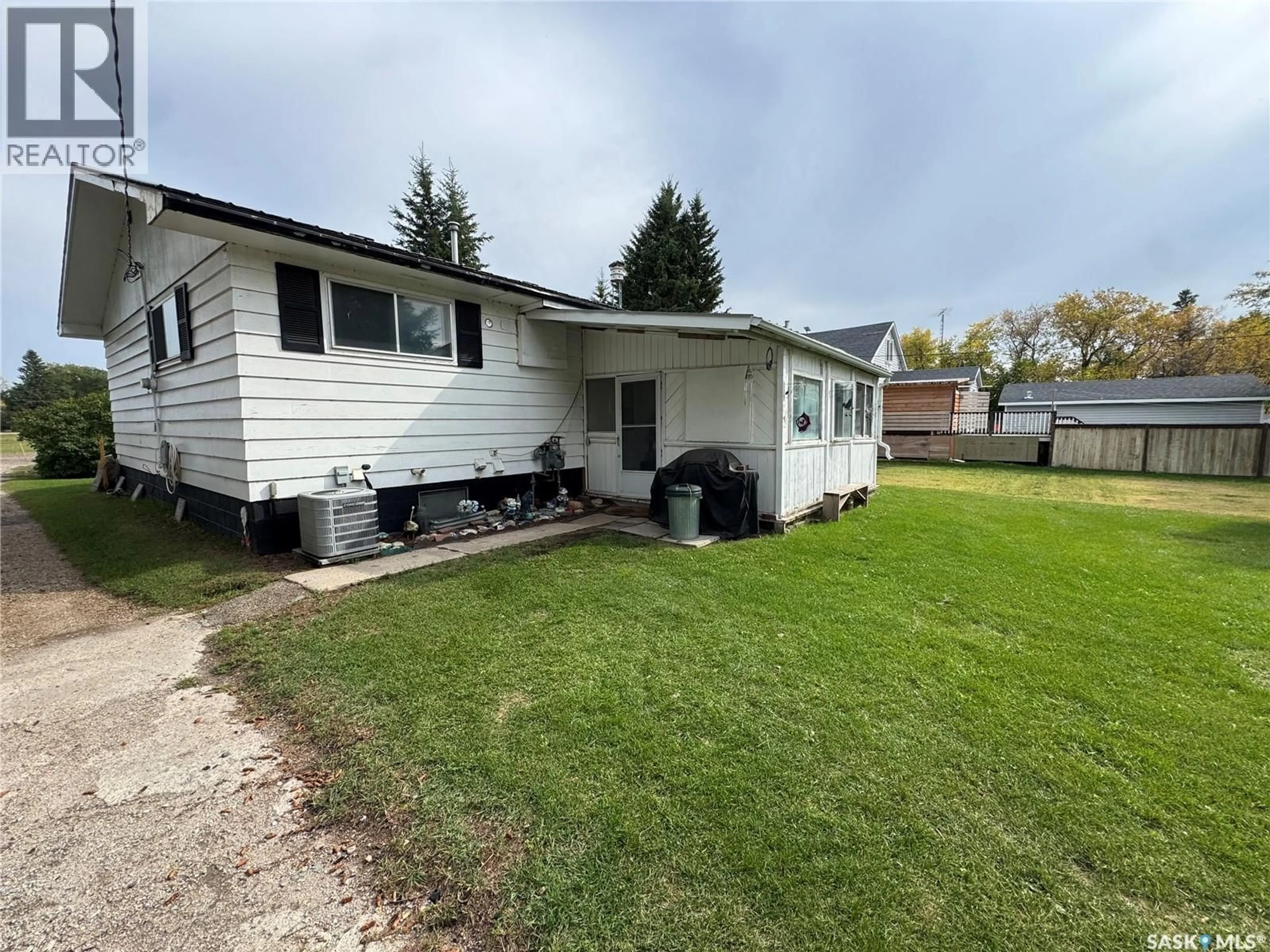 Home with vinyl exterior material, street for 100 1ST AVENUE, Spalding Saskatchewan S0K4C0
