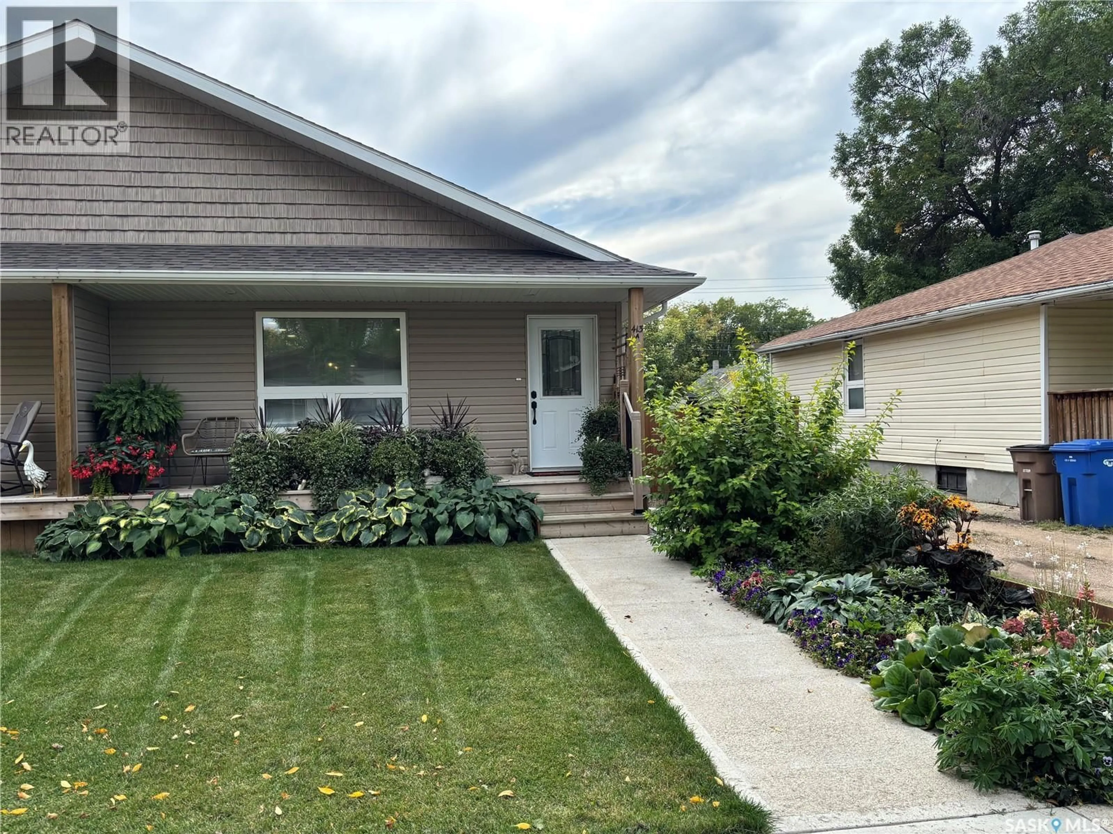 Home with vinyl exterior material, street for A - 413 CRAWFORD AVENUE, Melfort Saskatchewan S0E1A0